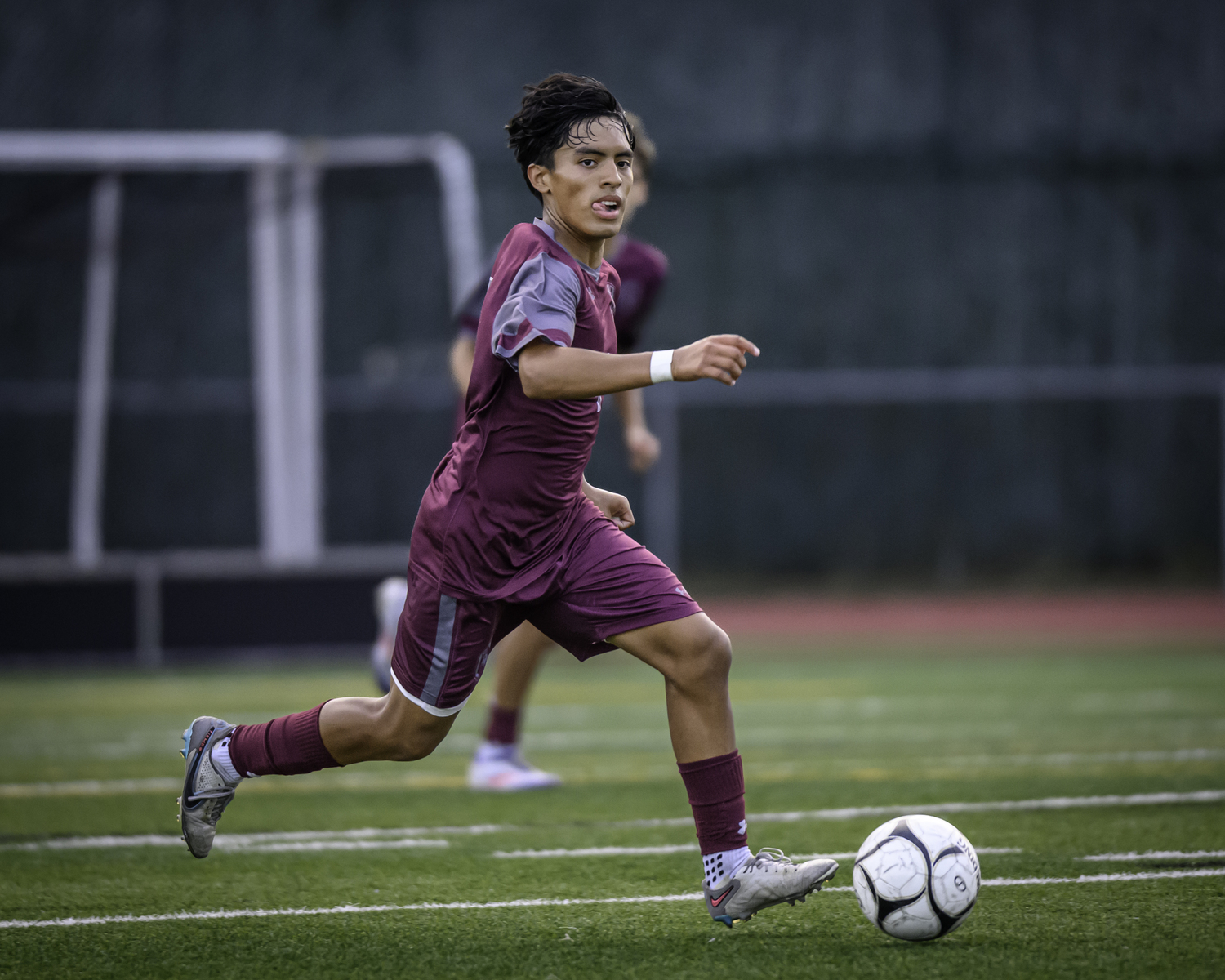 East Hampton senior Jonathan Armijos moves the ball across the field.   MARIANNE BARNETT