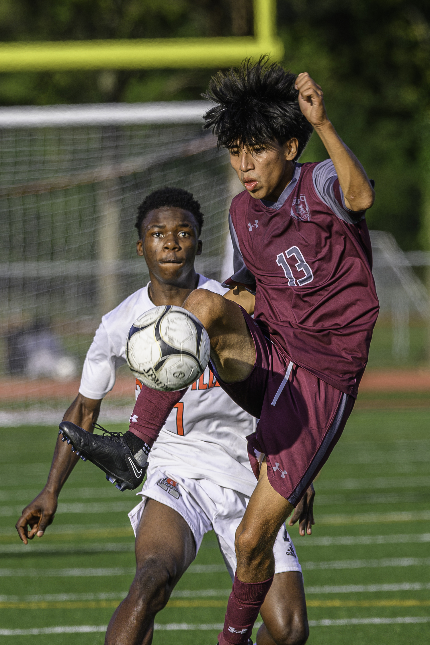 East Hampton senior Michael Chimbo settles the ball with his foot.  MARIANNE BARNETT