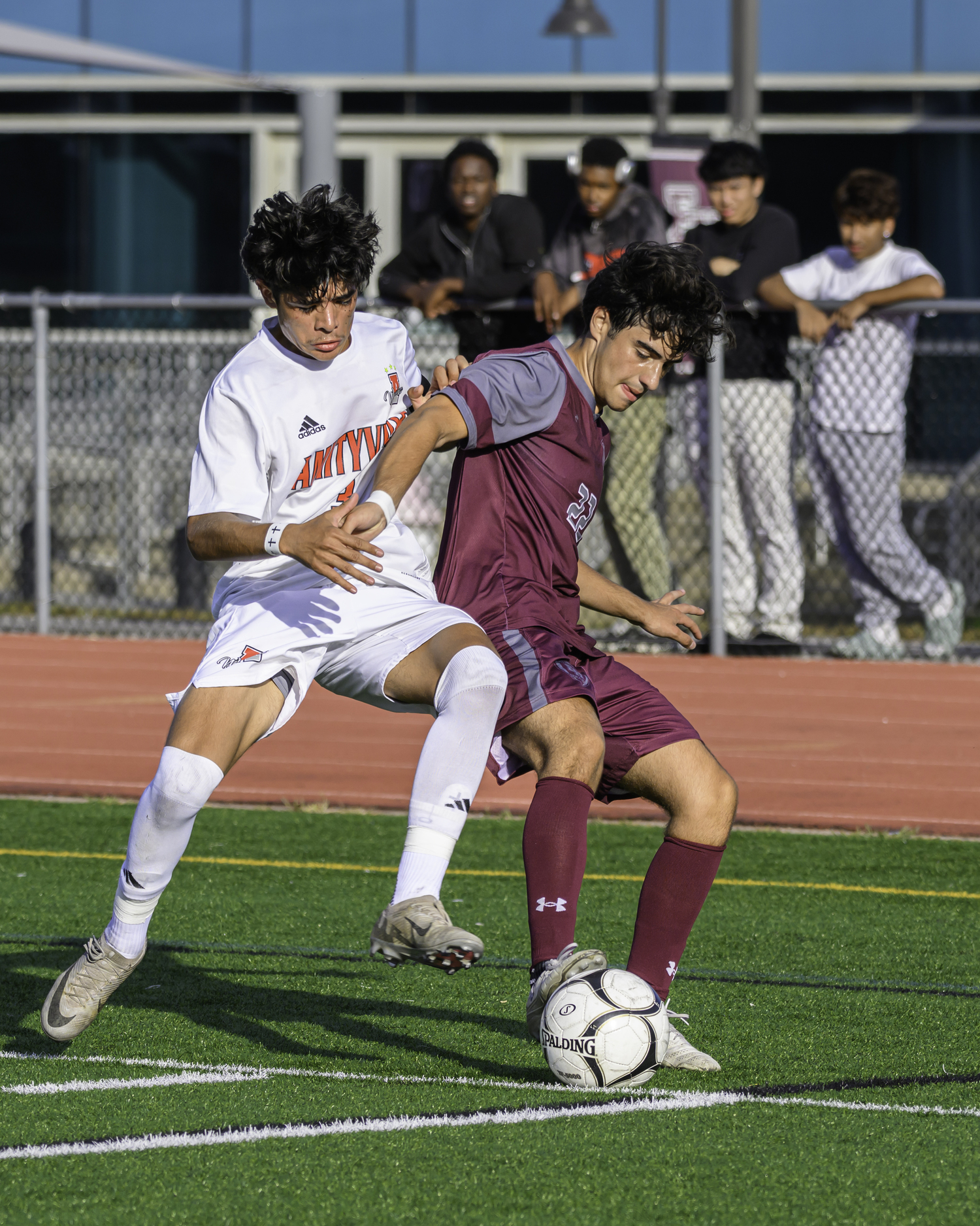 East Hampton senior Diego Duke fends off an Amityville player.   MARIANNE BARNETT