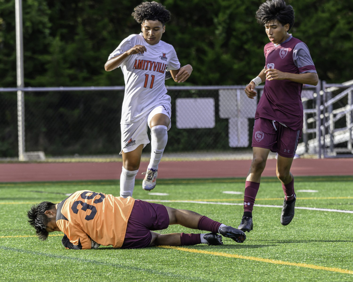 East Hampton senior goalie Randy Japa comes out to corral a loose ball in the box.   MARIANNE BARNETT