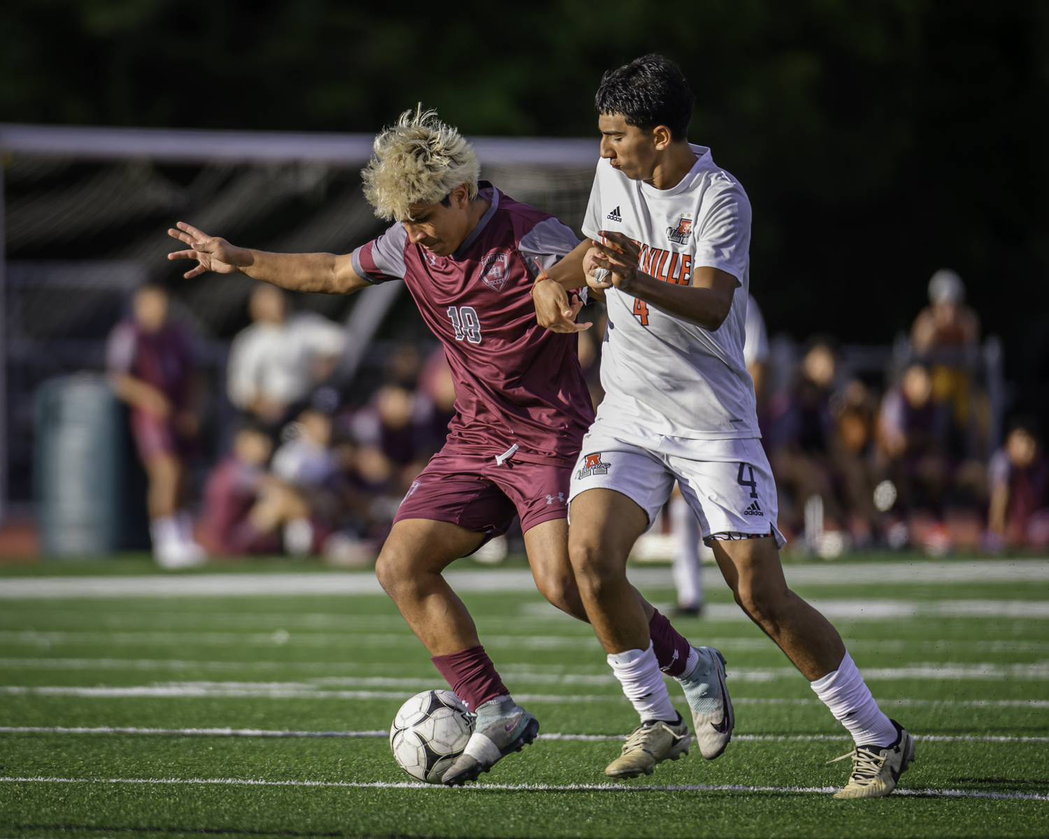 East Hampton senior Juan Salcedo fends off an Amityville player.   MARIANNE BARNETT