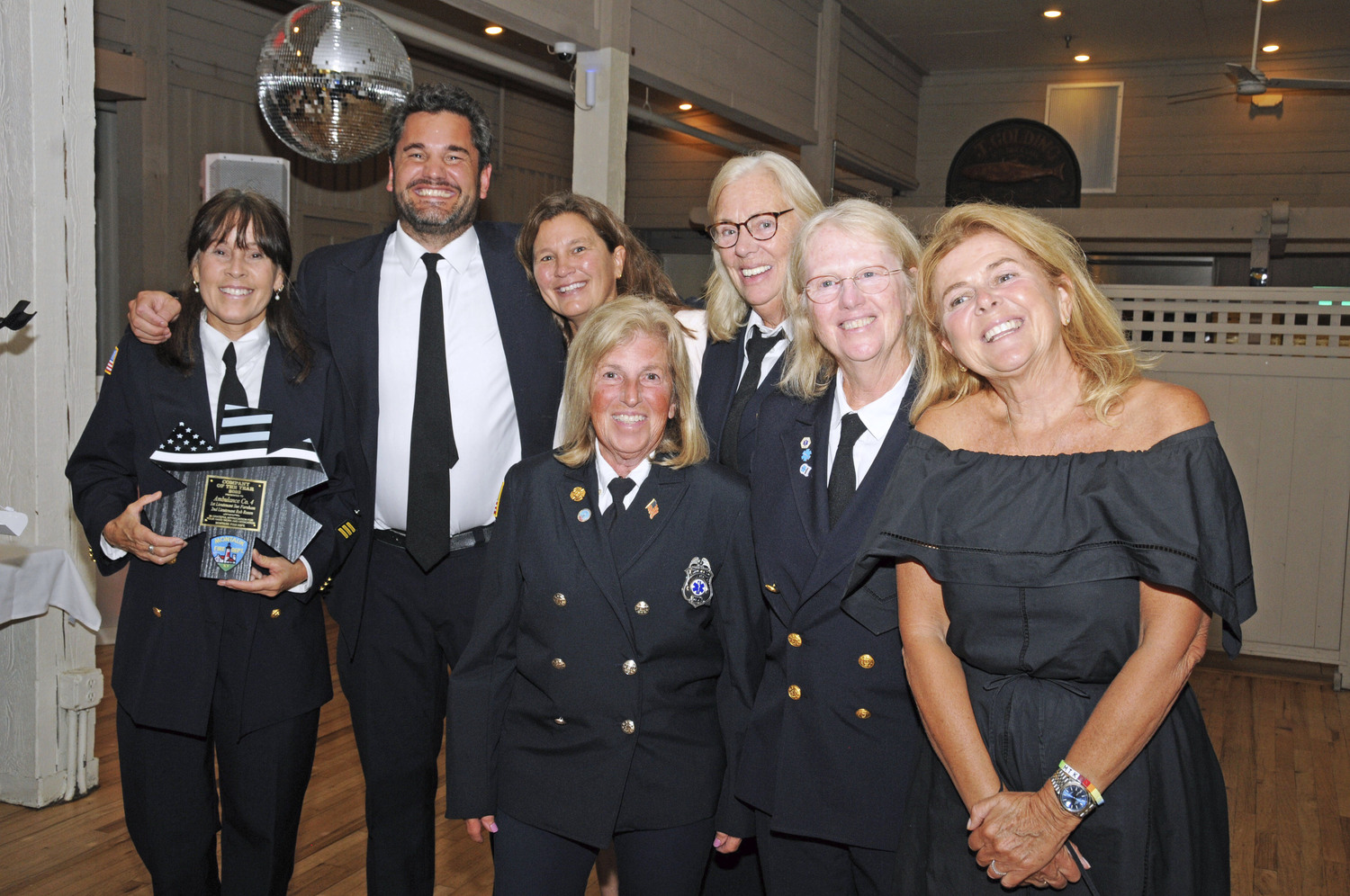 Ambulance Company No.4 Captain Ellen Cooke holding the 2023 Company of the Year Award with fellow Company No. 4 Members at Gosman's Restaurant on Friday at the the Montauk Fire Department held their annual Inspection Dinner, to honor the 2023 outstanding Members for their special contributions. The three Chiefs presented awards for longevity of membership, Ambulance Member of the Year (Agnes Cindrich), Firefighter of the Year (Joe McDonald), Company of the Year (Ambulance Company No.4), the Chiefs Award (Dennis O'Reilly). Suffolk County Legislator Ann Welker presented a special Proclamation to Ambulance Company's Alan Burke for his lifetime of service to the Montauk Fire Department.   RICHARD LEWIN