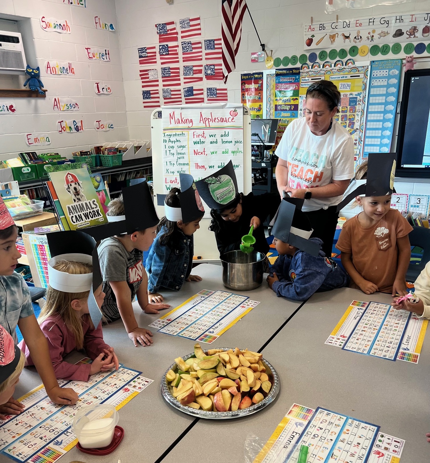 East Quogue School kindergarten students wore apple-themed hats and made applesauce to celebrate Johnny Appleseed Day on September 26. COURTESY EAST QUOGUE SCHOOL DISTRICT