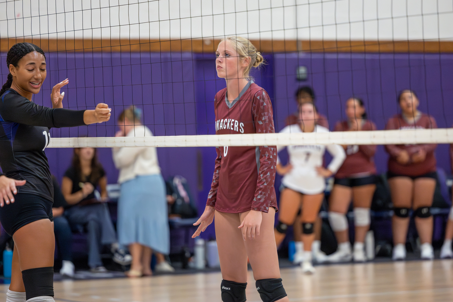 Junior Maryjane Vickers gets ready for a serve at the net.  RON ESPOSITO