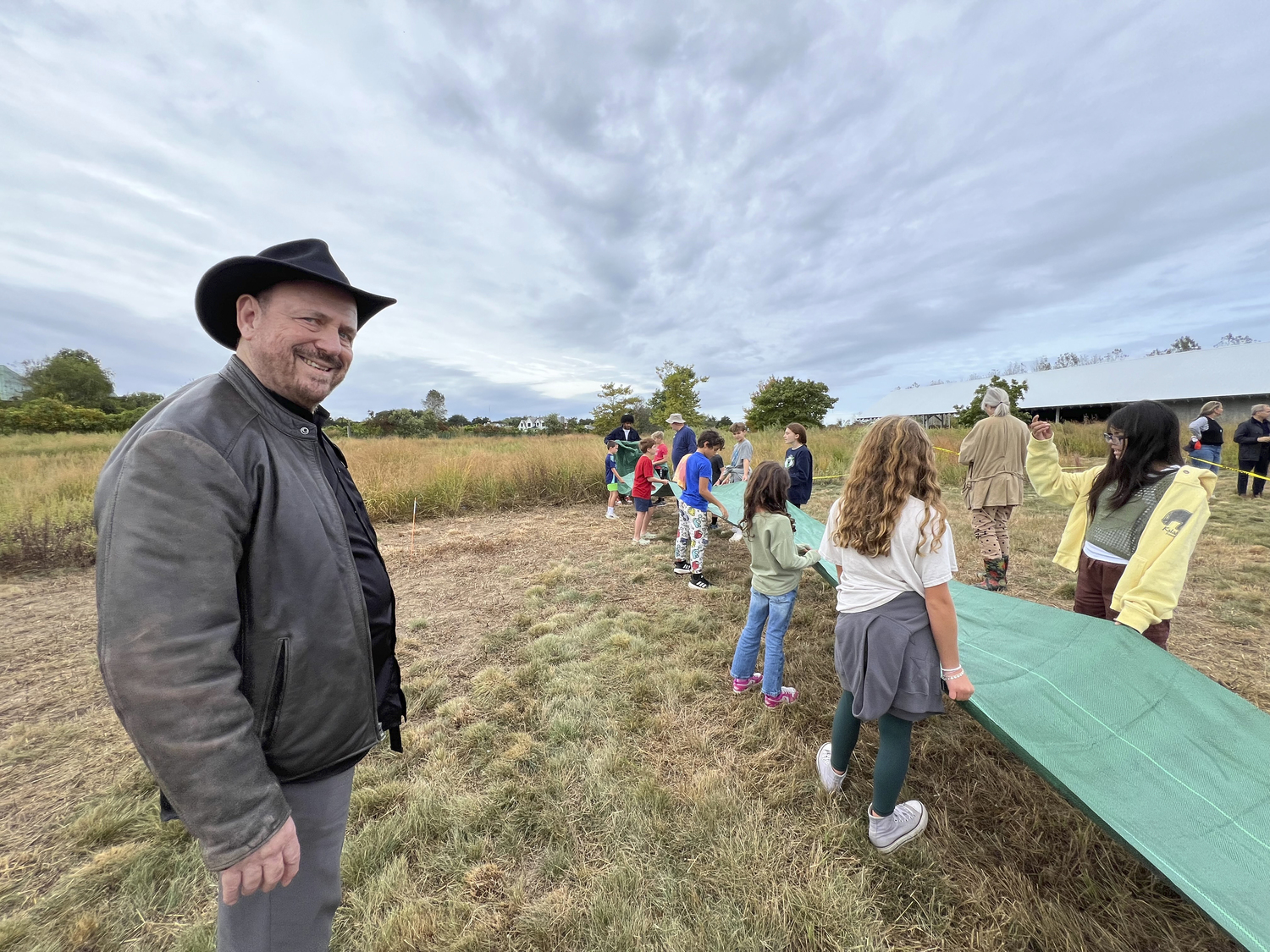 Under the direction of land art pioneer Alan Sonfist, left, students from the Hayground School began work on a two-year-long, eco-art project in the museum’s front meadow. Titled 