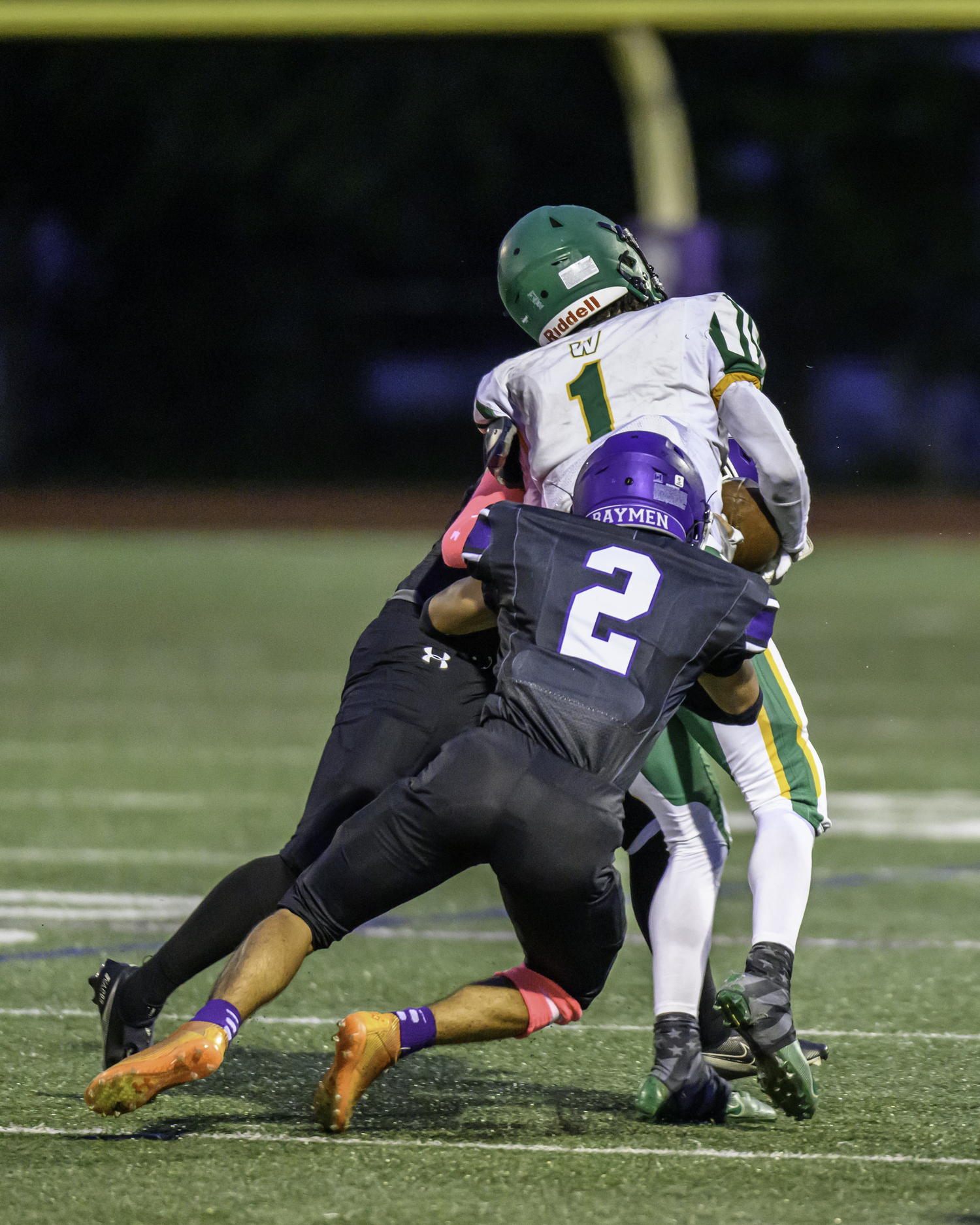 Hampton Bays senior Kevin Saa Pacheco pairs up with a teammate for a tackle.   MARIANNE BARNETT