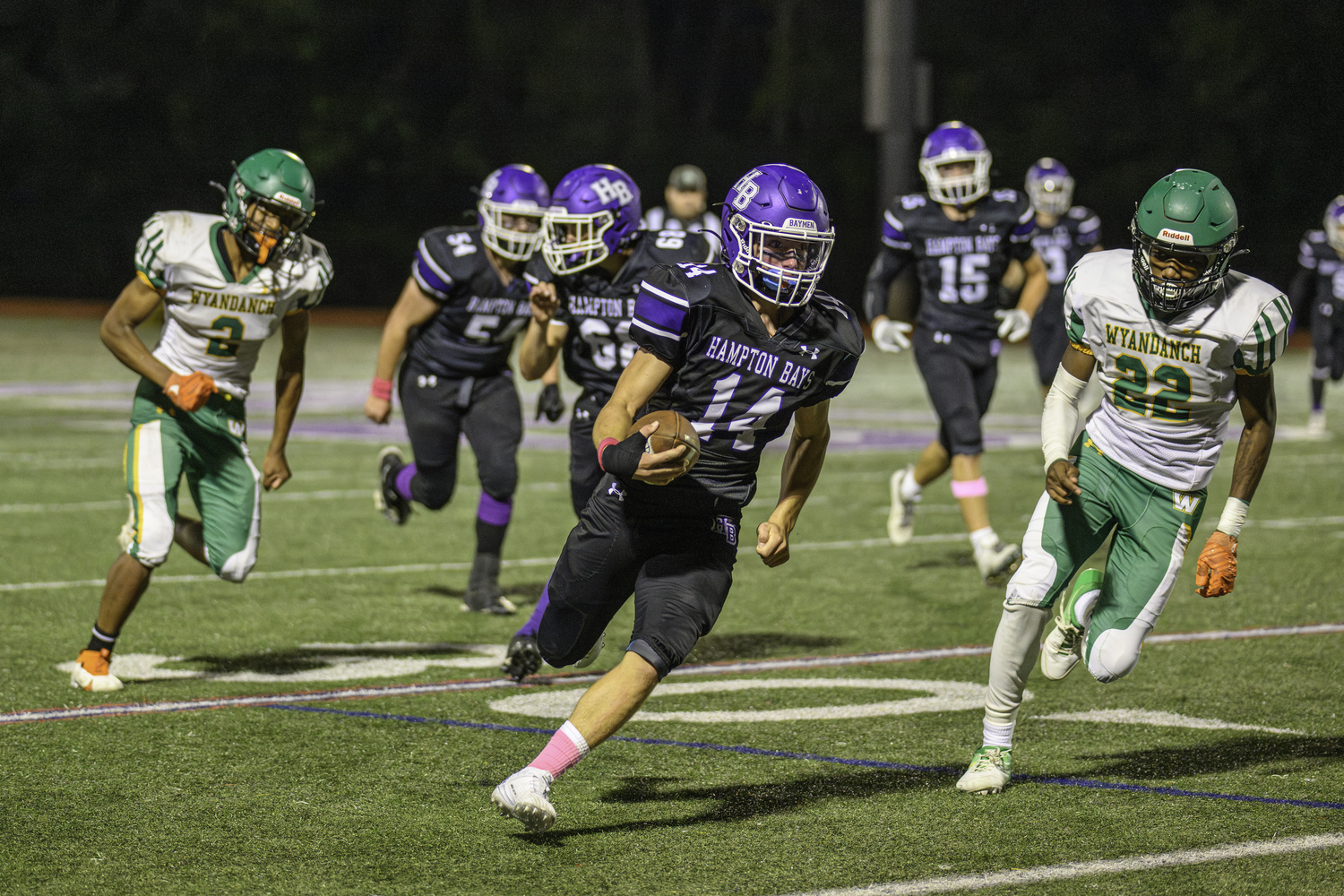 Michael Single runs back the interception deep into Wyandanch territory.   MARIANNE BARNETT