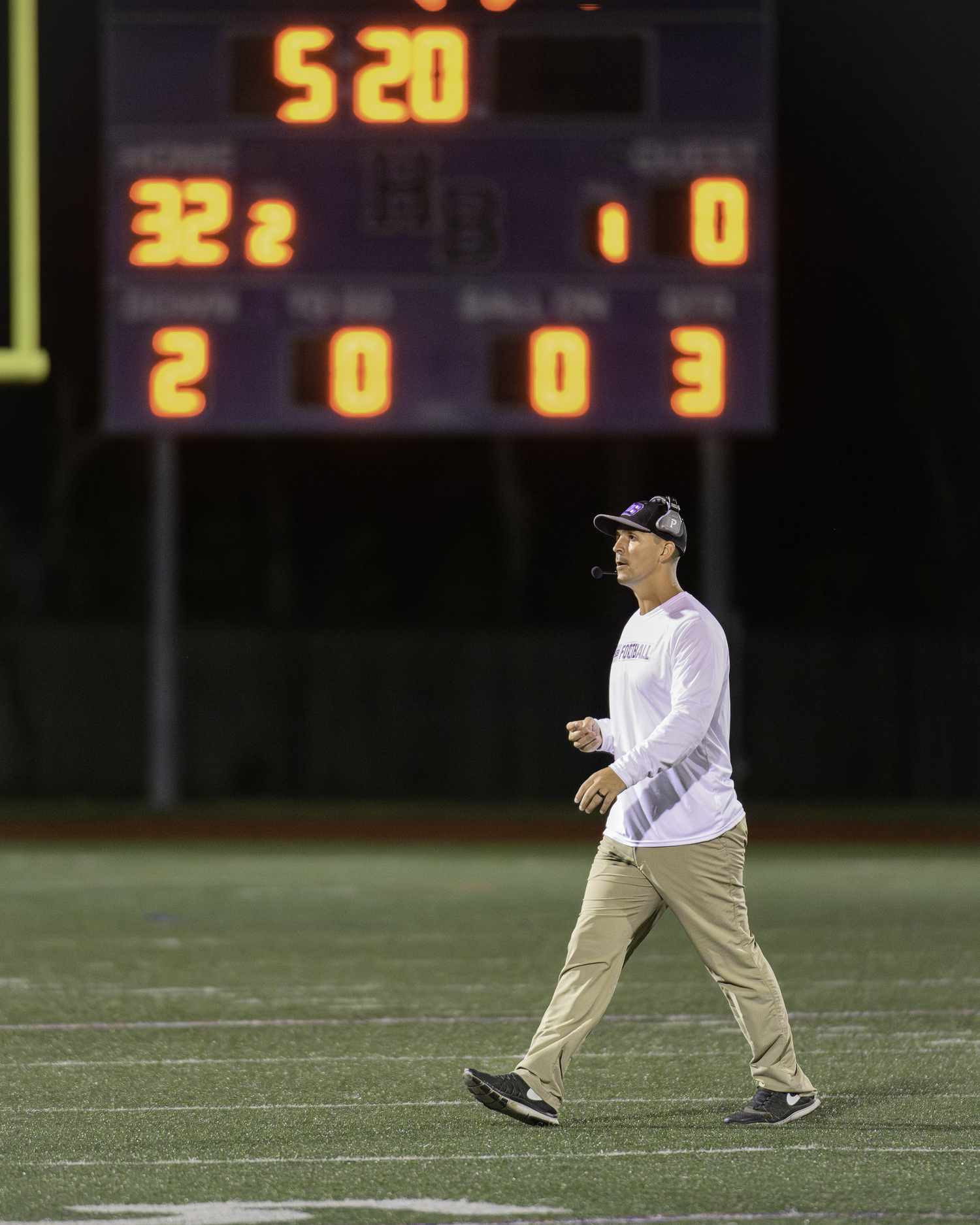 Hampton Bays head coach Sean Gil walks back to the sideline with a break in the action and his team up big in the second half on Friday night.   MARIANNE BARNETT