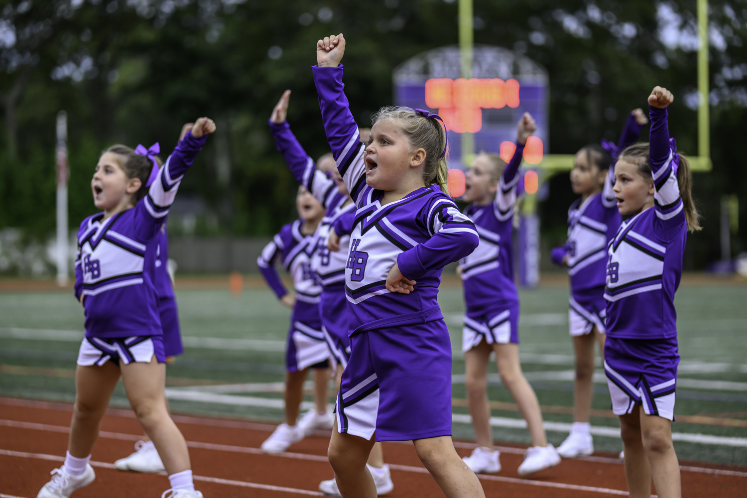 As part of its homecoming weekend, cheerleaders of all ages got to take part in Friday night's festivities.  MARIANNE BARNETT