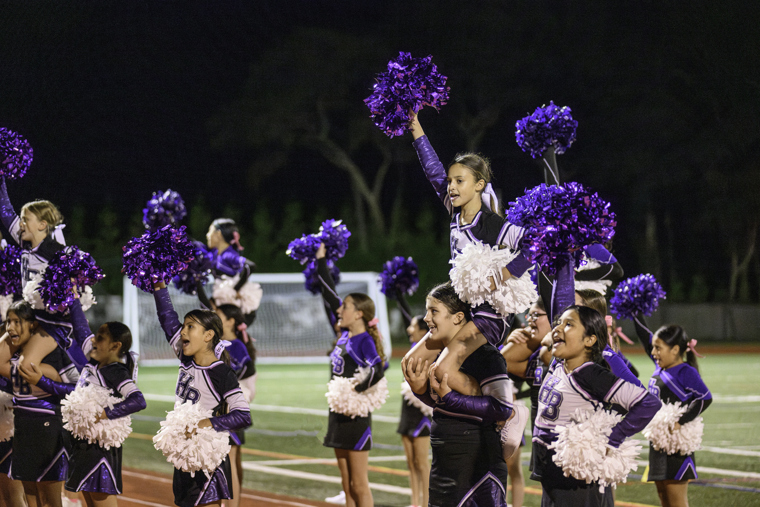 As part of its homecoming weekend, cheerleaders of all ages got to take part in Friday night's festivities.  MARIANNE BARNETT