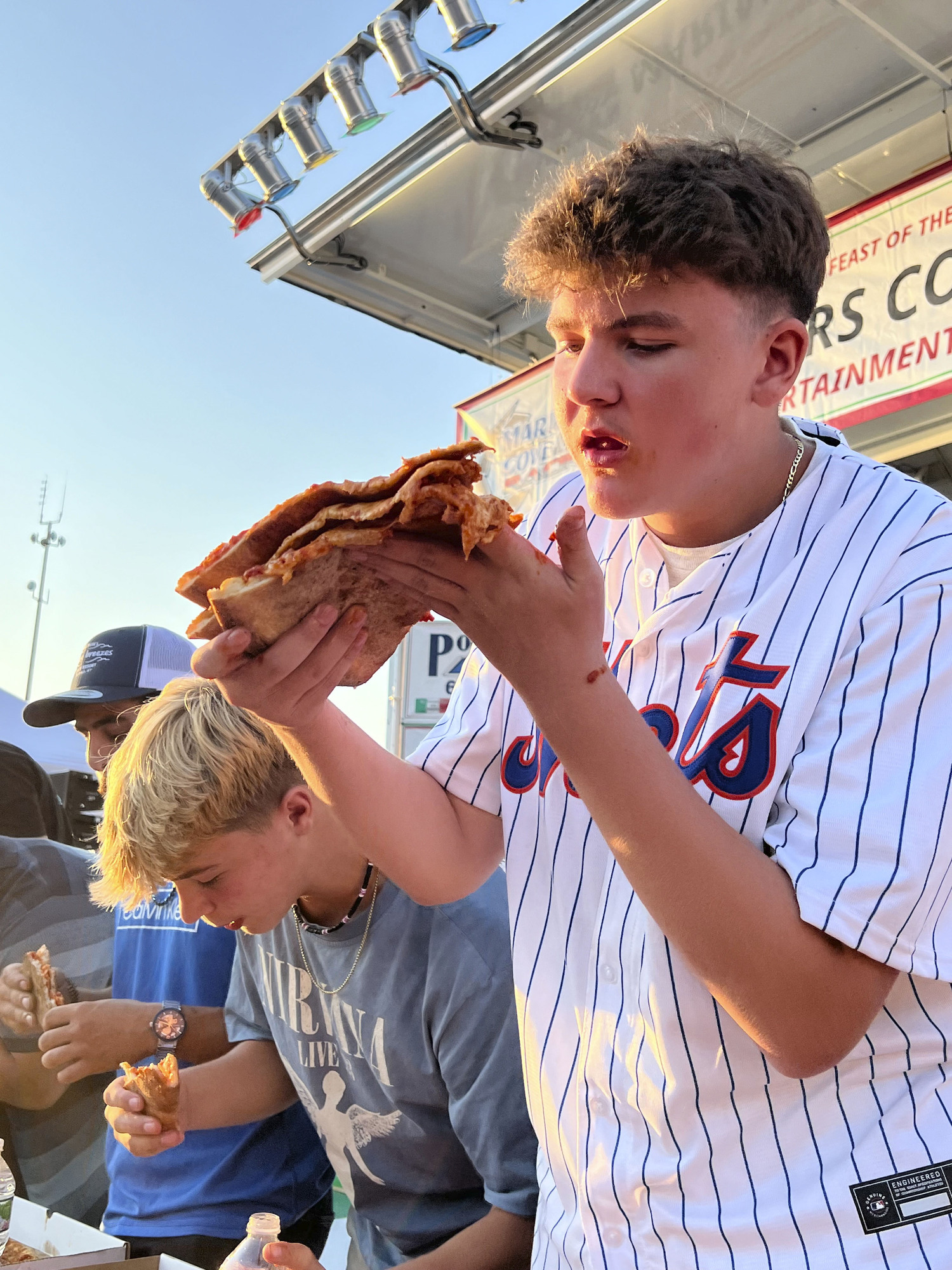 Liam Fitzgerald during the pizza eating contest at the San Gennaro Feast of the Hampton on Saturday.