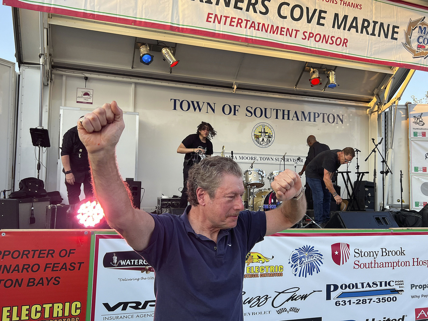 Chris Scull of Hampton Bays wins the pizza eating contest at the San Gennaro Feast of the Hamptons on Saturday.