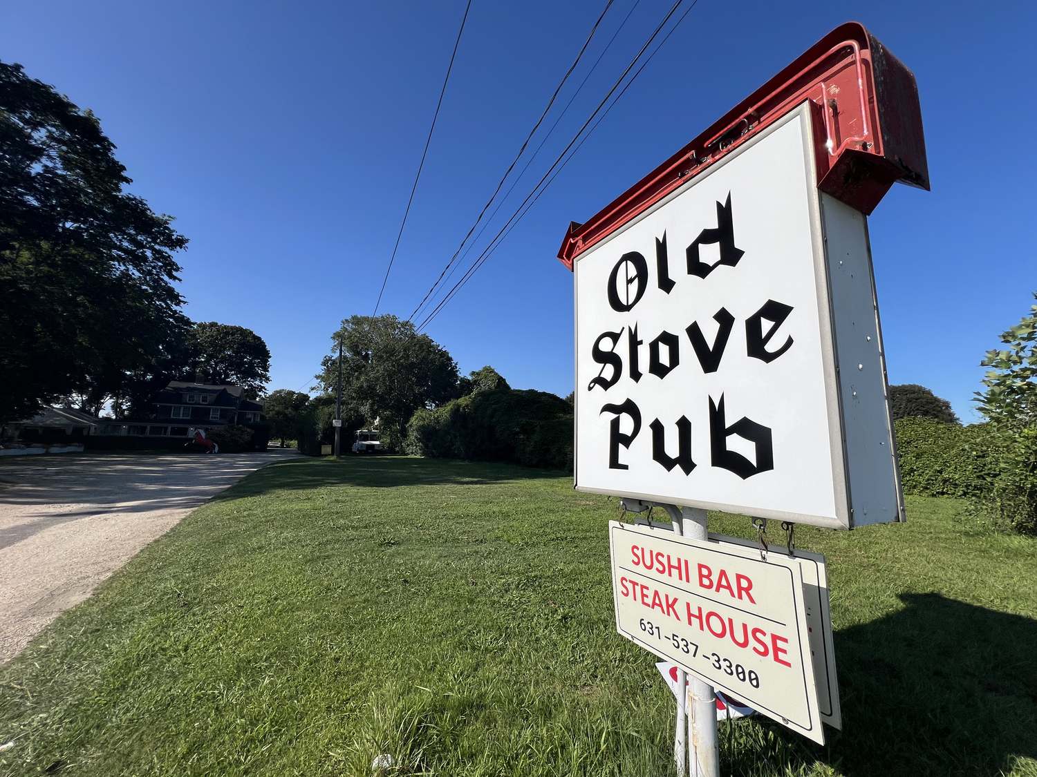 The iconic Old Stove Pub sign in Sagaponack.  DANA SHAW