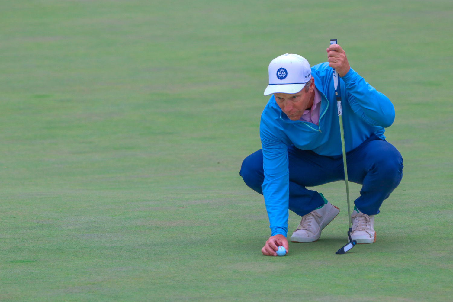 Southampton Golf Club pro Louis DeKerrilis places his ball down and lines up his next shot while playing in last week's Met PGA Championship. COURTESY METROPOLITAN PGA