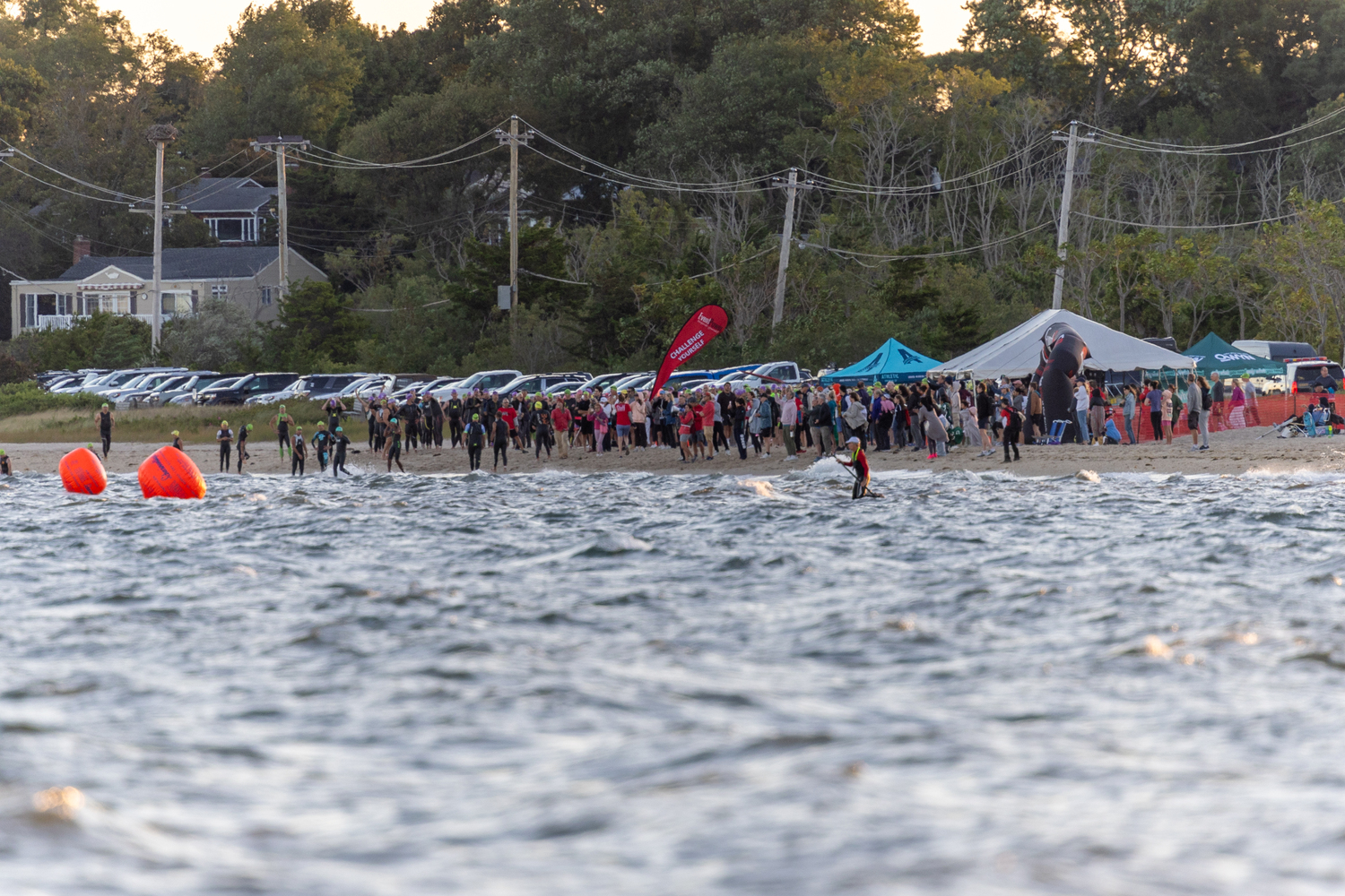 Onlookers watch at the Mighty Hamptons Steve Tarpinian Memorial Triathlon begins on Sunday morning.   RON ESPOSITO