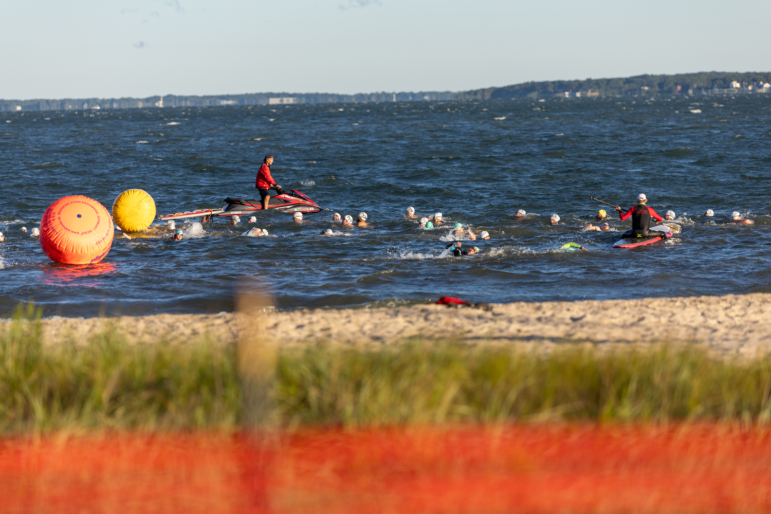 Swimmers in the water just off the shore at Long Beach for Sunday morning's Mighty Hamptons Steve Tarpinian Memorial Triathlon.   RON ESPOSITO