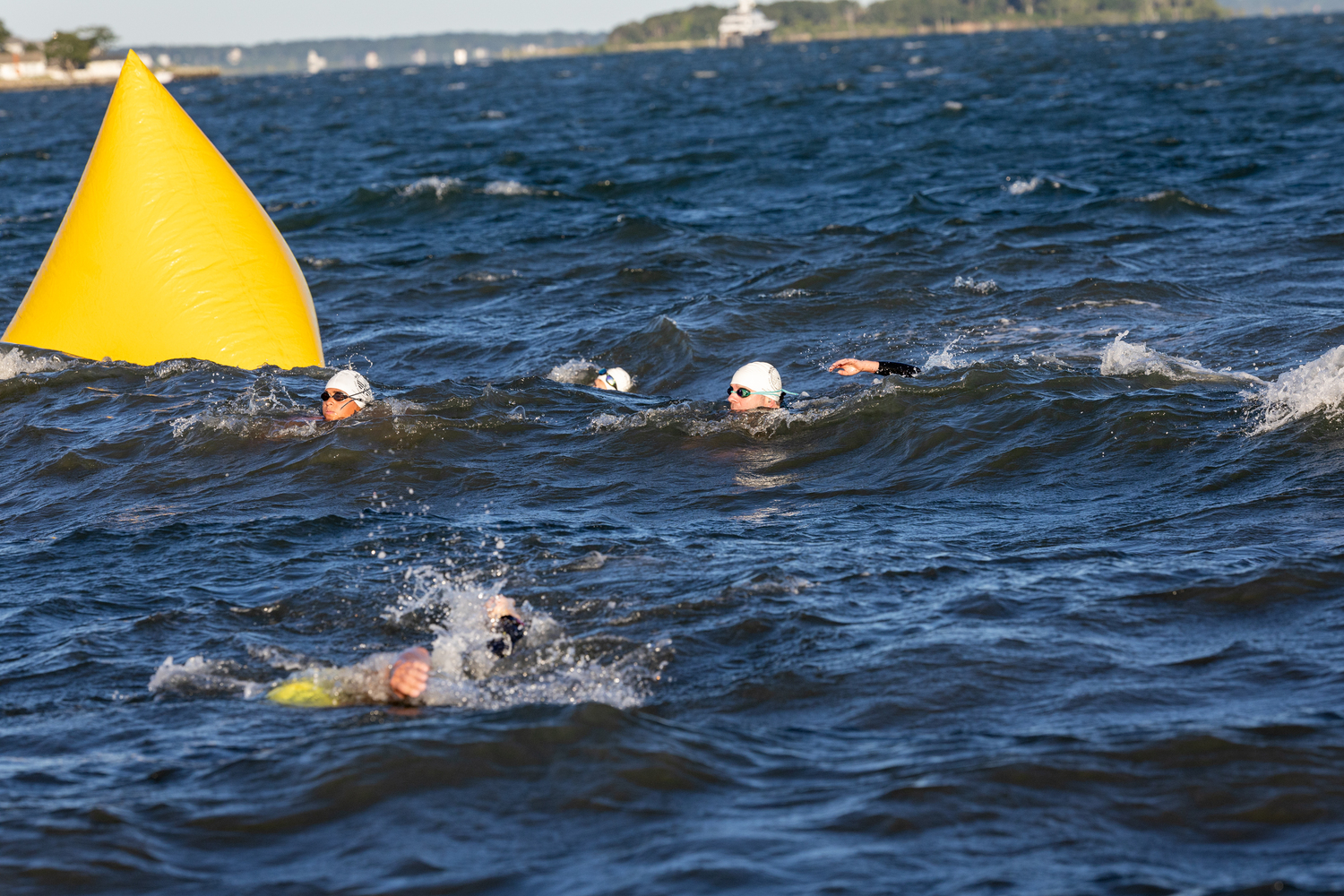 Triathletes come back ashore at Long Beach.   RON ESPOSITO