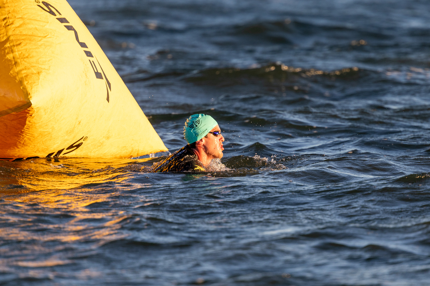 A triathlete in the water at Long Beach.   RON ESPOSITO