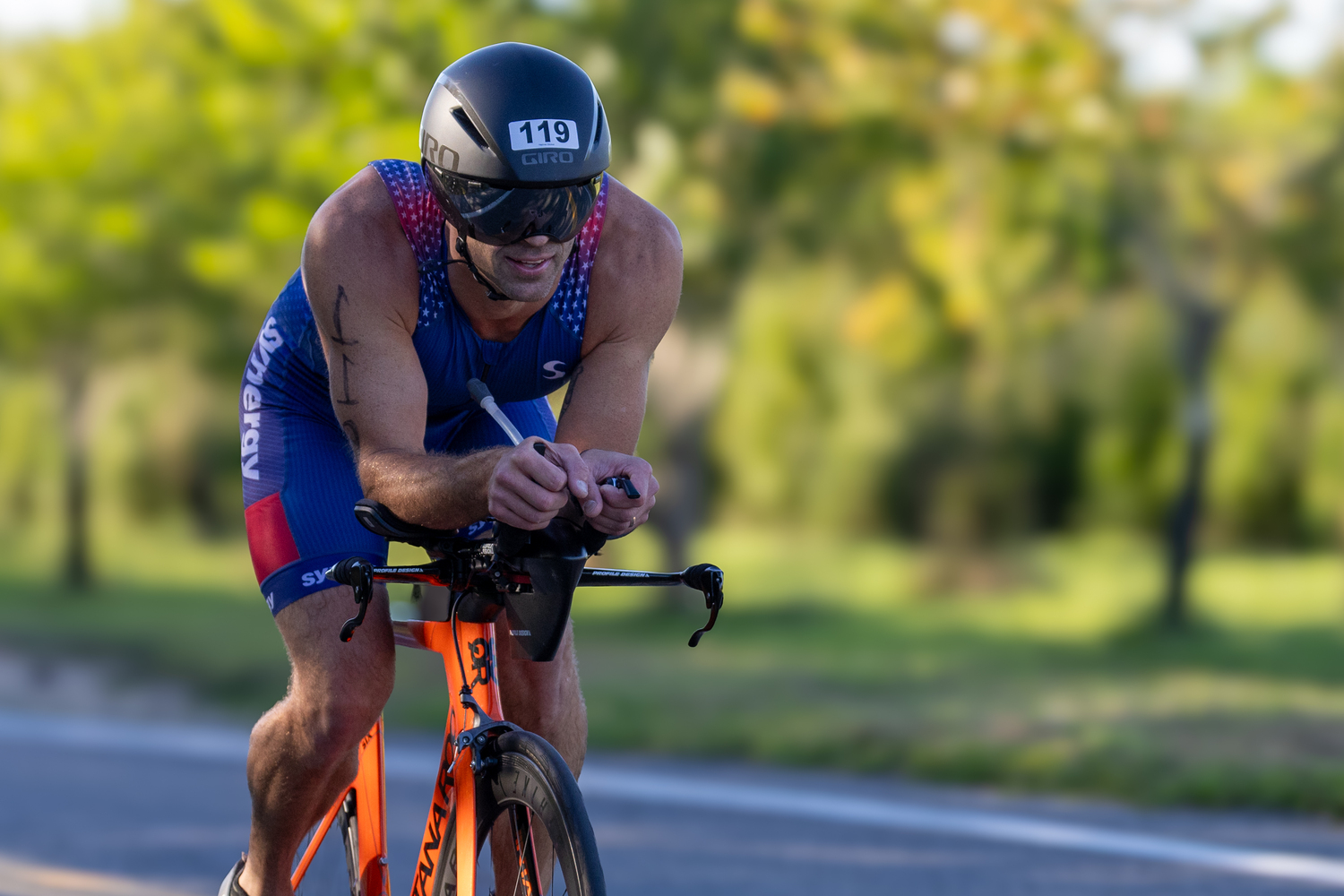 Travis Miranda of Brooklyn in the bike portion of Sunday morning's triathlon. RON ESPOSITO