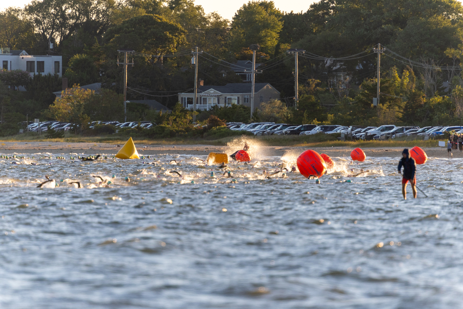 Swimmers in the water just off the shore at Long Beach for Sunday morning's Mighty Hamptons Steve Tarpinian Memorial Triathlon.   RON ESPOSITO