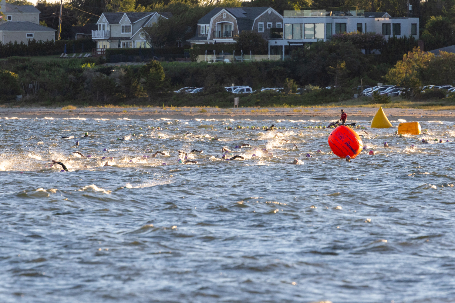 Swimmers in the water just off the shore at Long Beach for Sunday morning's Mighty Hamptons Steve Tarpinian Memorial Triathlon.   RON ESPOSITO