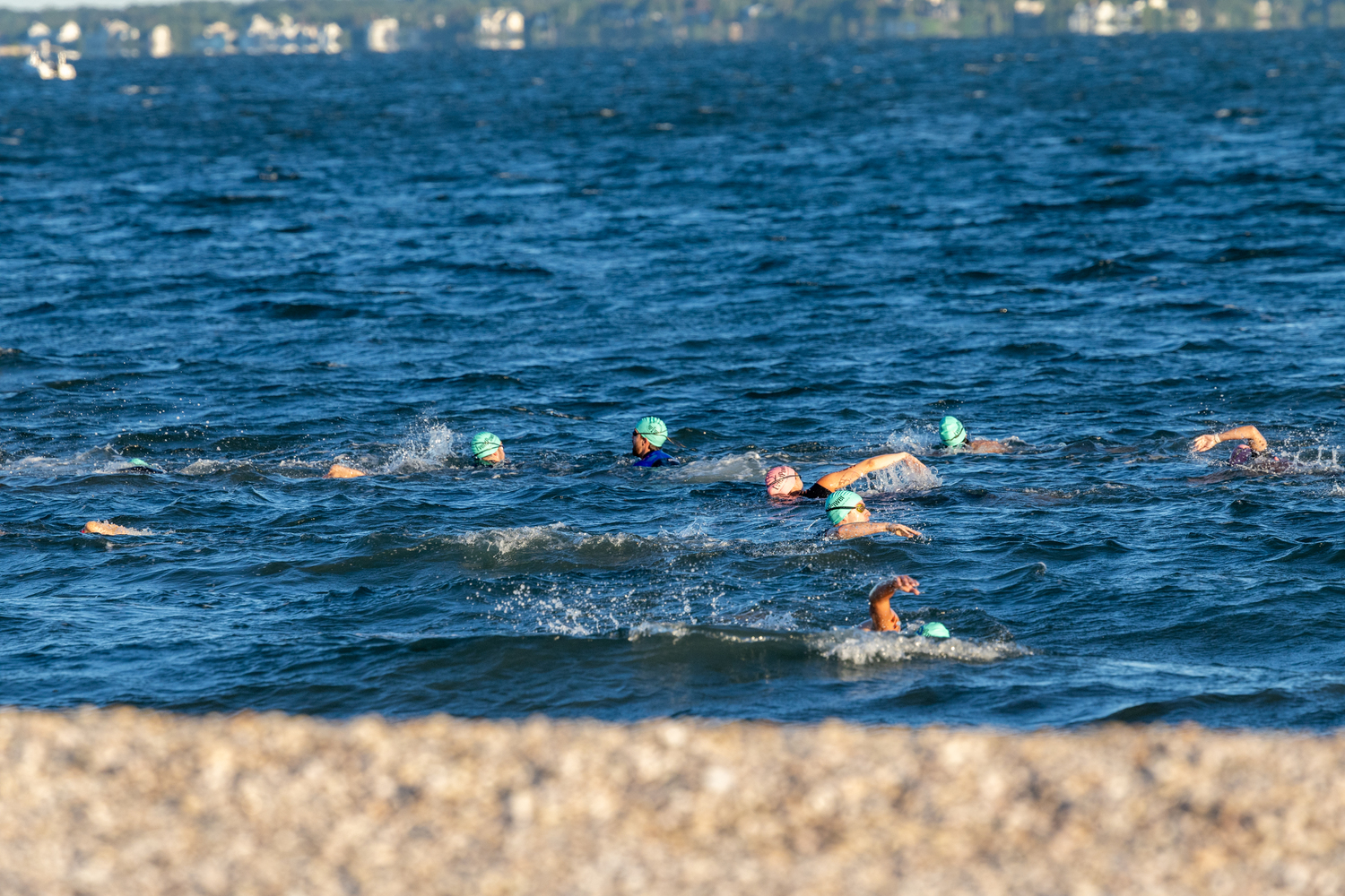 Swimmers in the water just off the shore at Long Beach for Sunday morning's Mighty Hamptons Steve Tarpinian Memorial Triathlon.   RON ESPOSITO