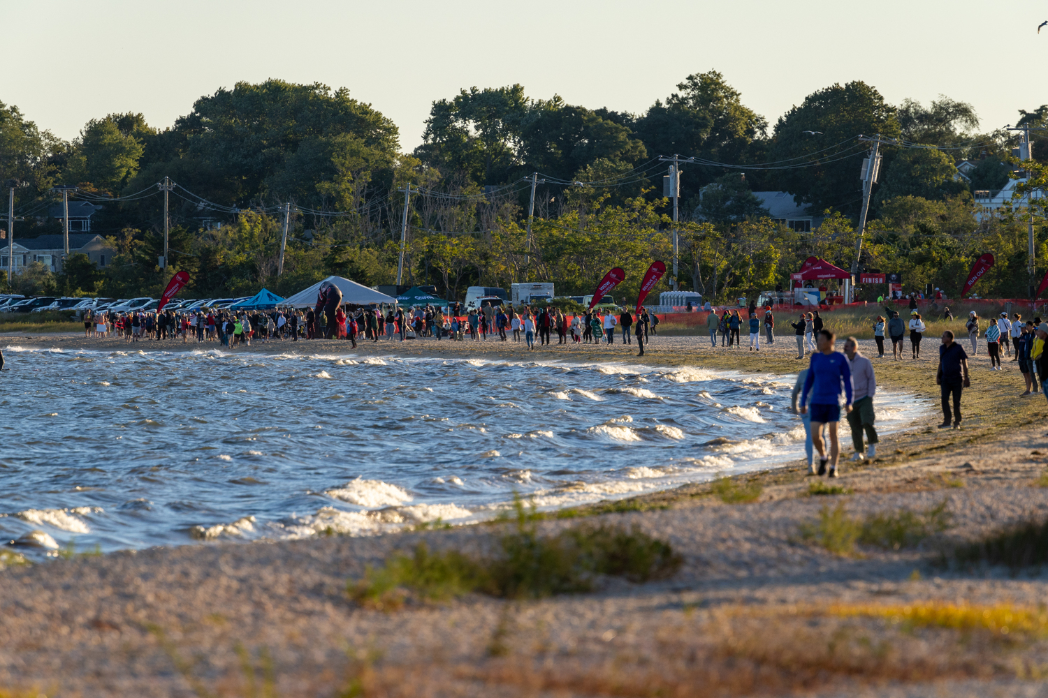 Onlookers watch at the Mighty Hamptons Steve Tarpinian Memorial Triathlon begins on Sunday morning.   RON ESPOSITO