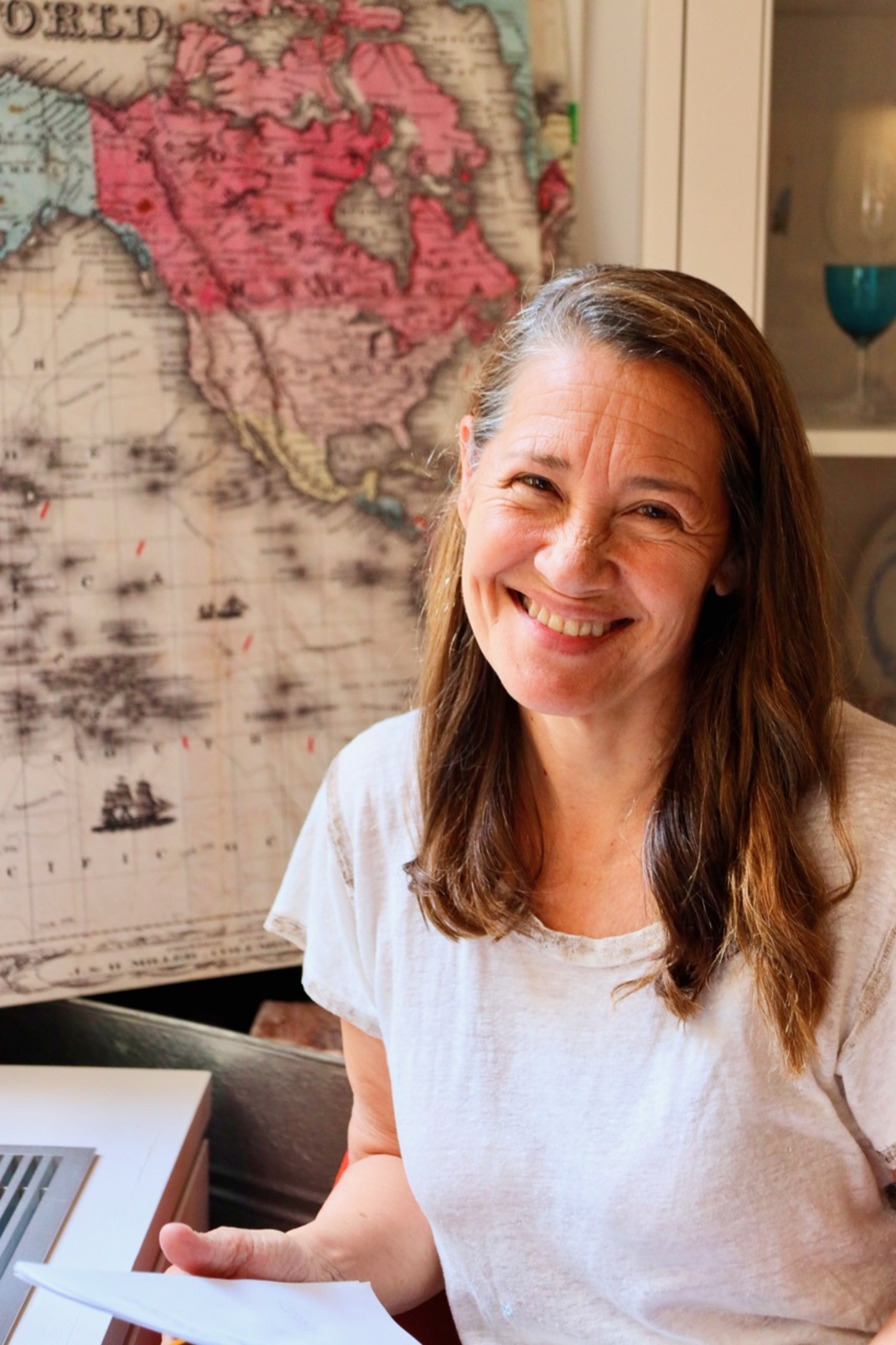 Playwright Martha Pichey in front of Colton's Map of the World from 1852. GILLIAN GORDON