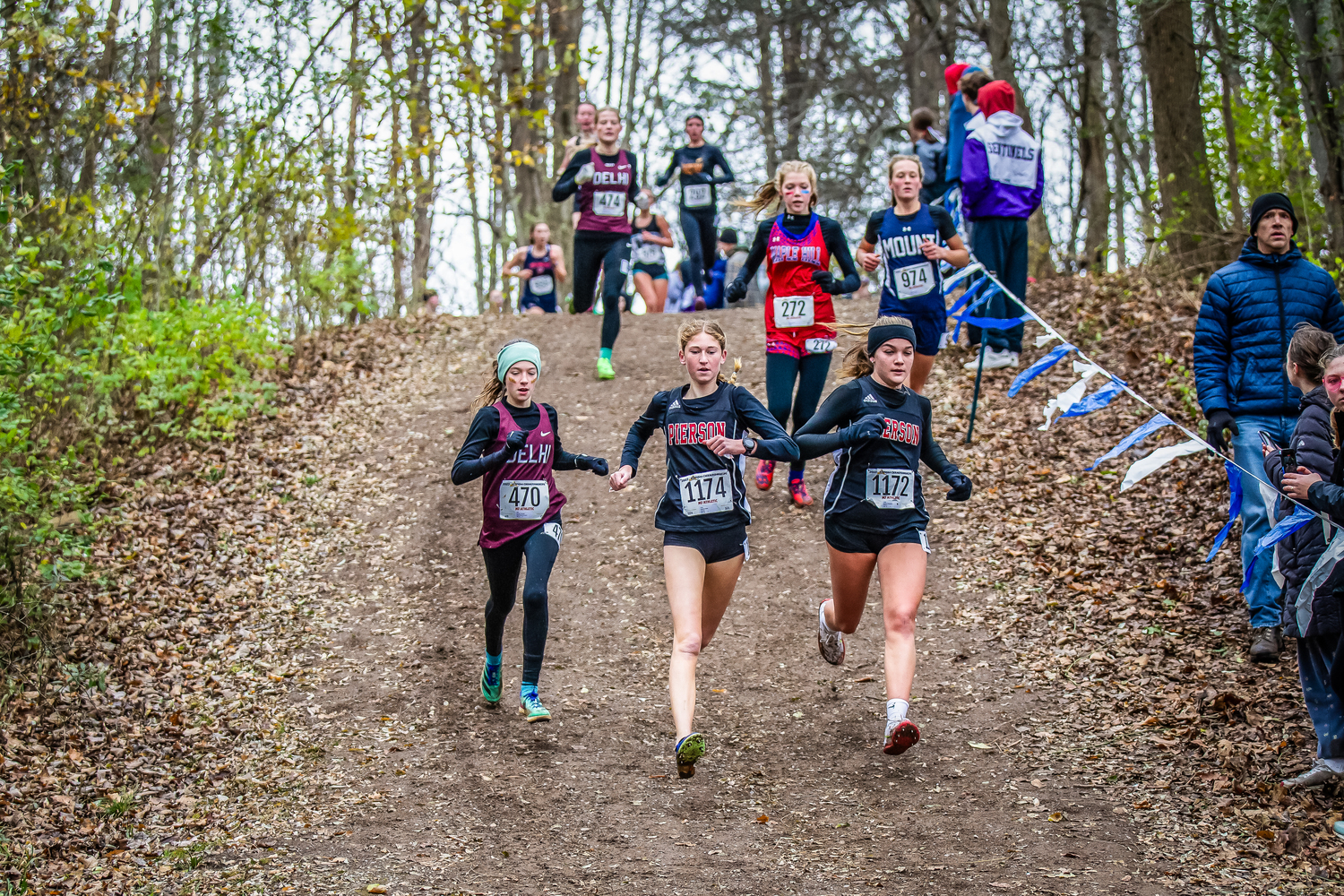 Sara O'Brien, left, and Greylynn Guyer running up at states last year.   REBECCA MCMANUS