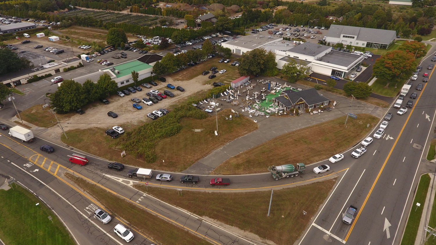 The high end EV maker Rivian wants to turn the Patio.com showroom at the corner of Montauk Higway and County Road 39 into a charging outpost, lounge and brand store. County engineers have told them to eliminate the western driveway from the property onto CR39 and use the eastern driveway onto Montauk Highway as the only access and egress. But Southampton Town officials worried that could cause significant problems thanks to the chronic congestion on the roadway during both the morning and afternoon rush hours.