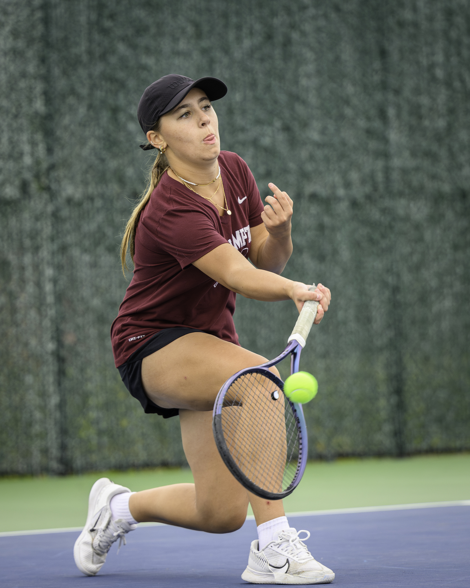 Southampton sophomore Kirra Krzenski reaches for a return. MARIANNE BARNETT