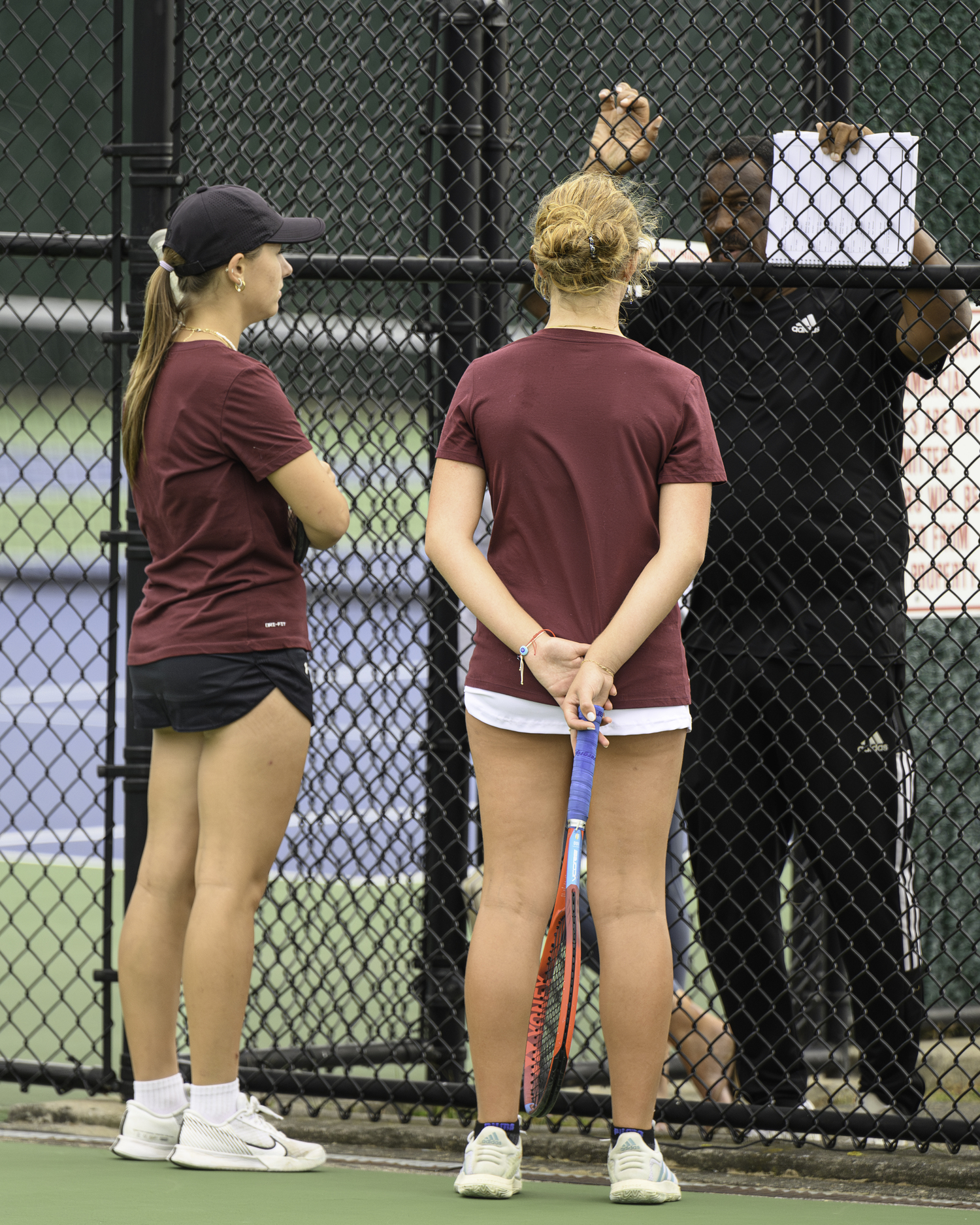 Southampton sophomores Kirra Krzenski and Mateya Silvera meet with head coach Richard 