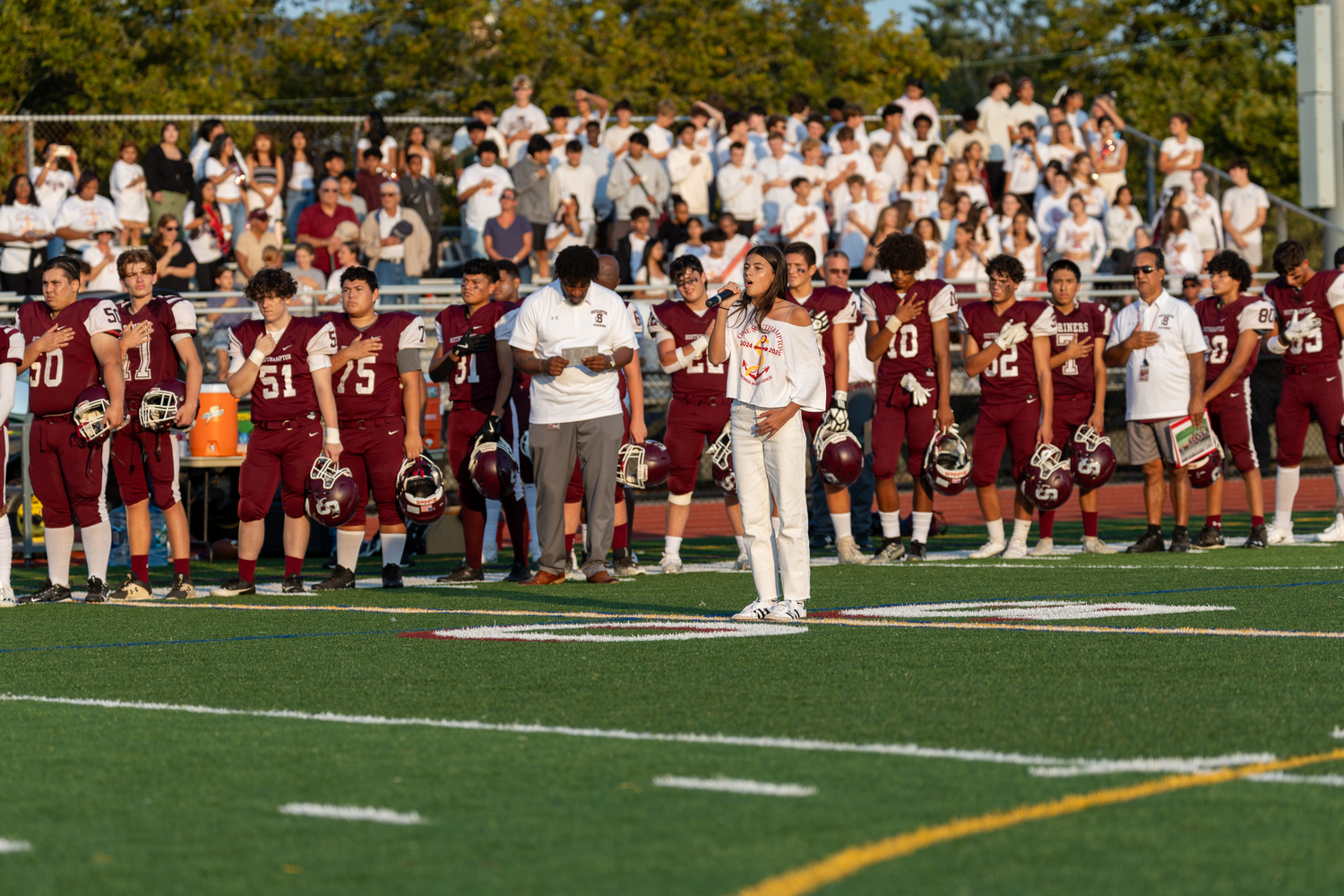 Emma Suhr sings the national anthem prior to Friday night's homecoming game. SOUTHAMPTON SCHOOL DISTRICT/RON ESPOSITO