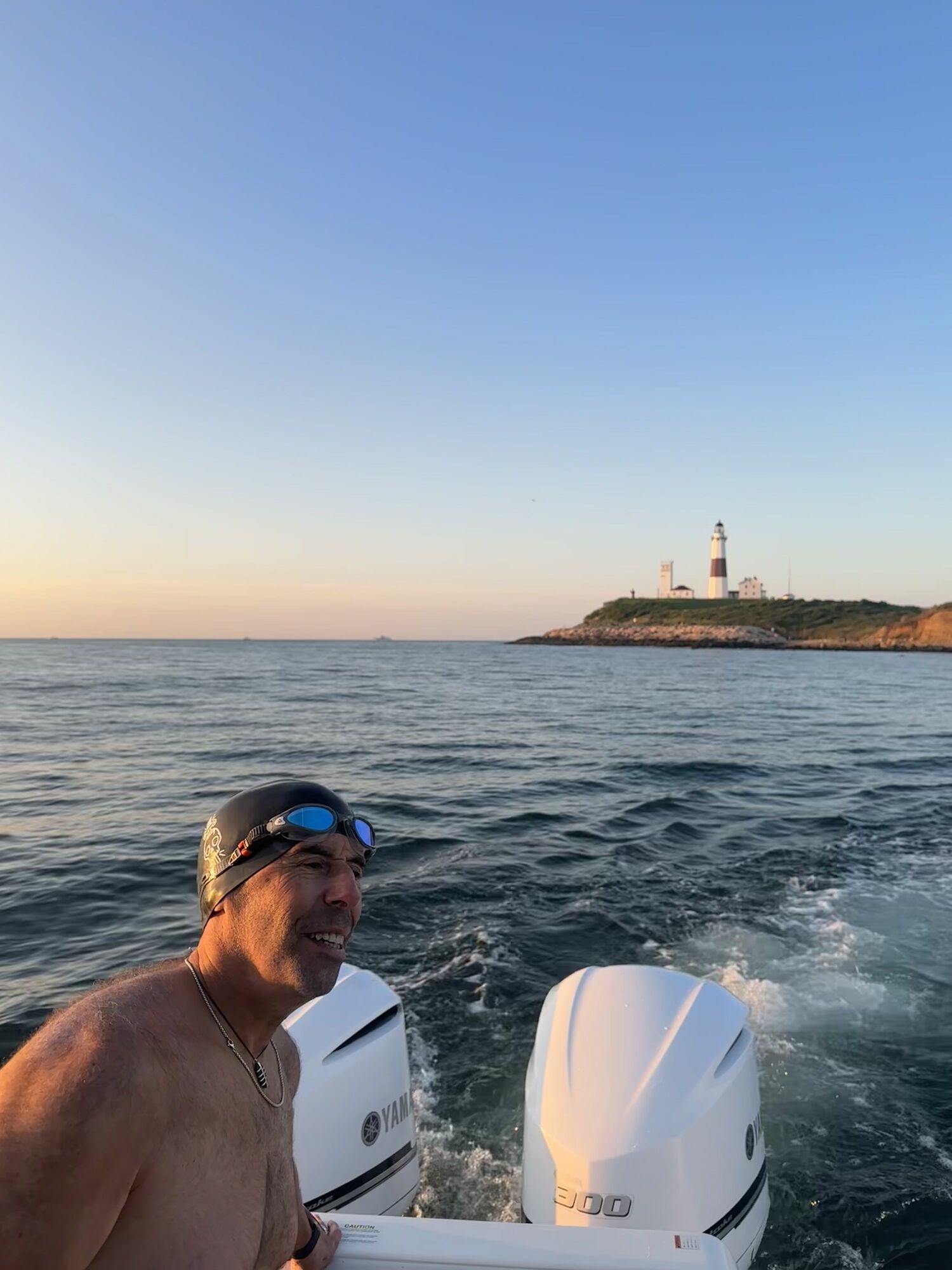 Spencer Schneider, who swam the first leg, prepares to enter the water. He swam back to land first before setting off for Block Island. COURTESY DAWGPATCH BANDITS