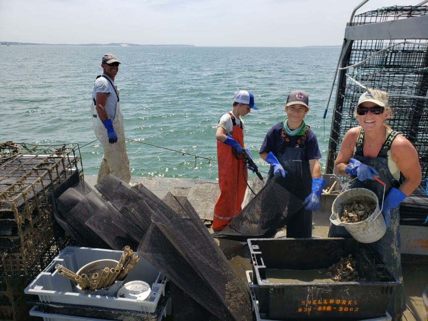 The Dunne family of Shellworks, working on Little Peconic Bay in Southampton. COURTESY BARLEY JOHN DUNNER