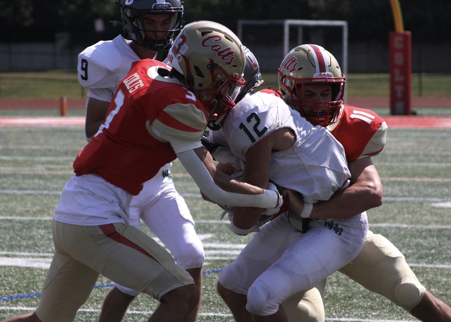 Senior running back Brody Schaffer is tackled on a run attempt. DESIRÉE KEEGAN