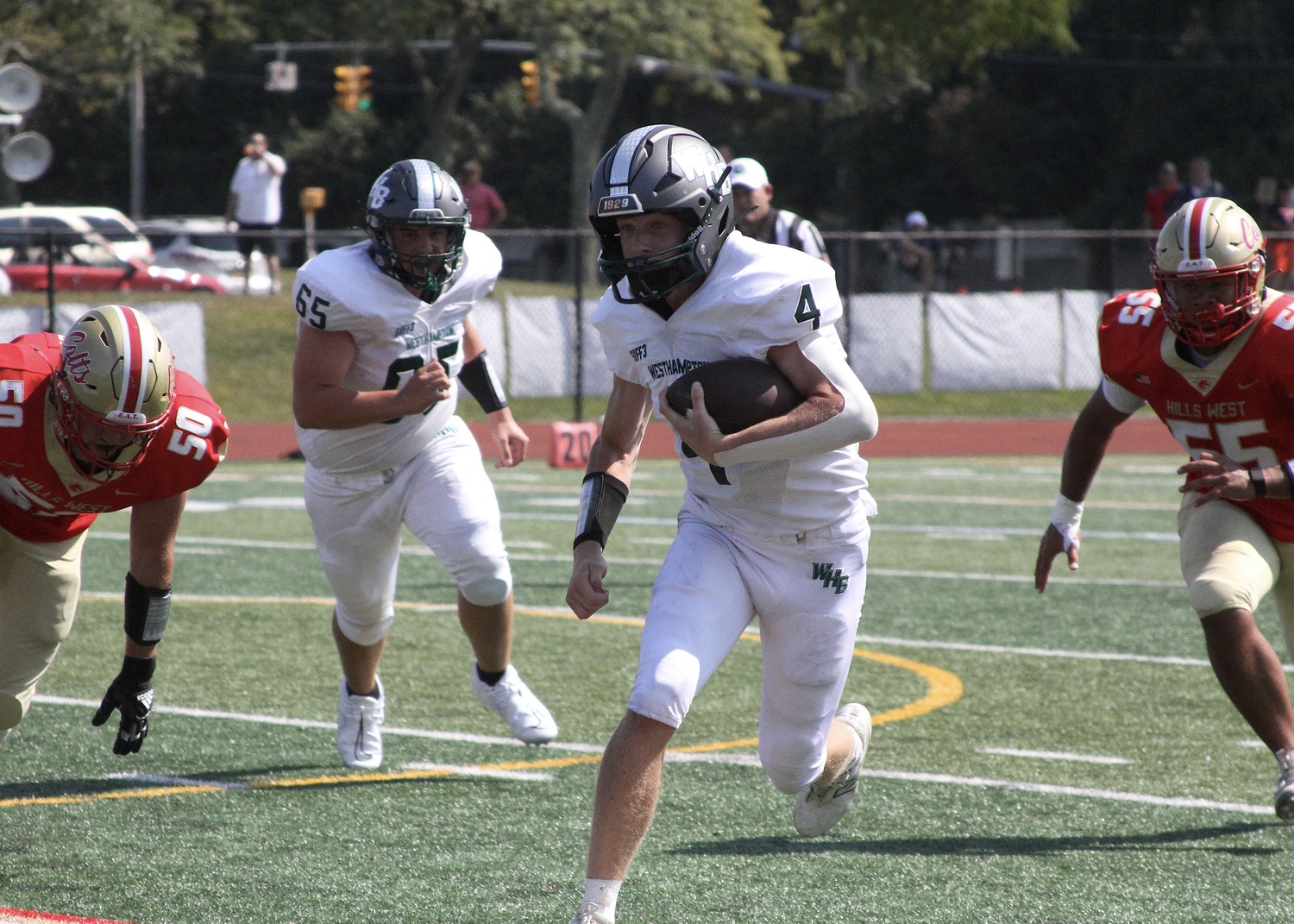 Sophomore quarterback Jake Calloway races with the ball. DESIRÉE KEEGAN