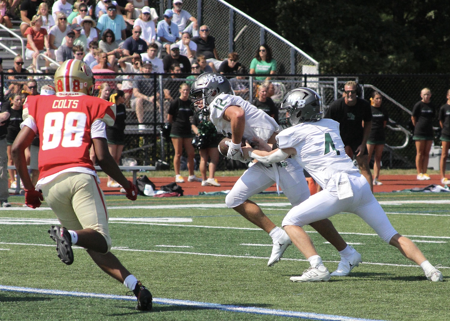 Senior running back Brody Schaffer grabs a handoff from sophomore quarterback Jake Calloway. DESIRÉE KEEGAN