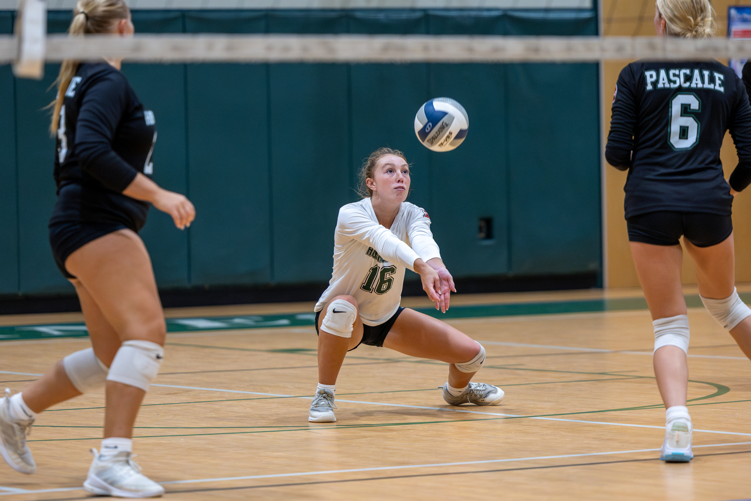 Senior libero Elliejean Burke digs out a return in a game against Islip. RON ESPOSITO