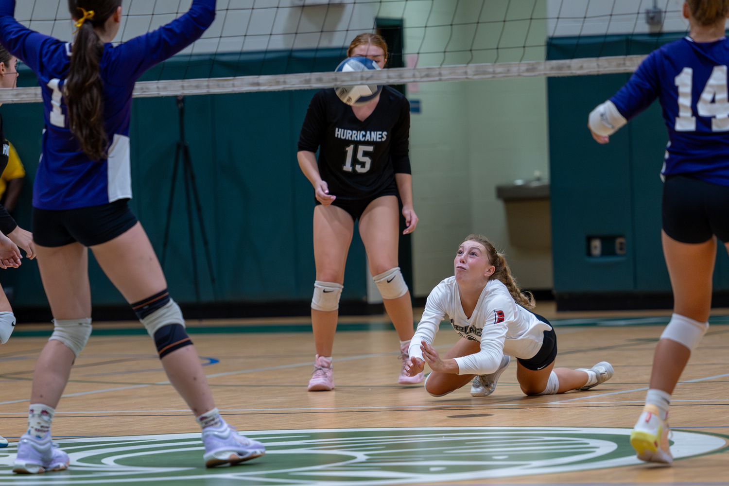 Senior libero Elliejean Burke dives for the ball in a game against Islip. RON ESPOSITO