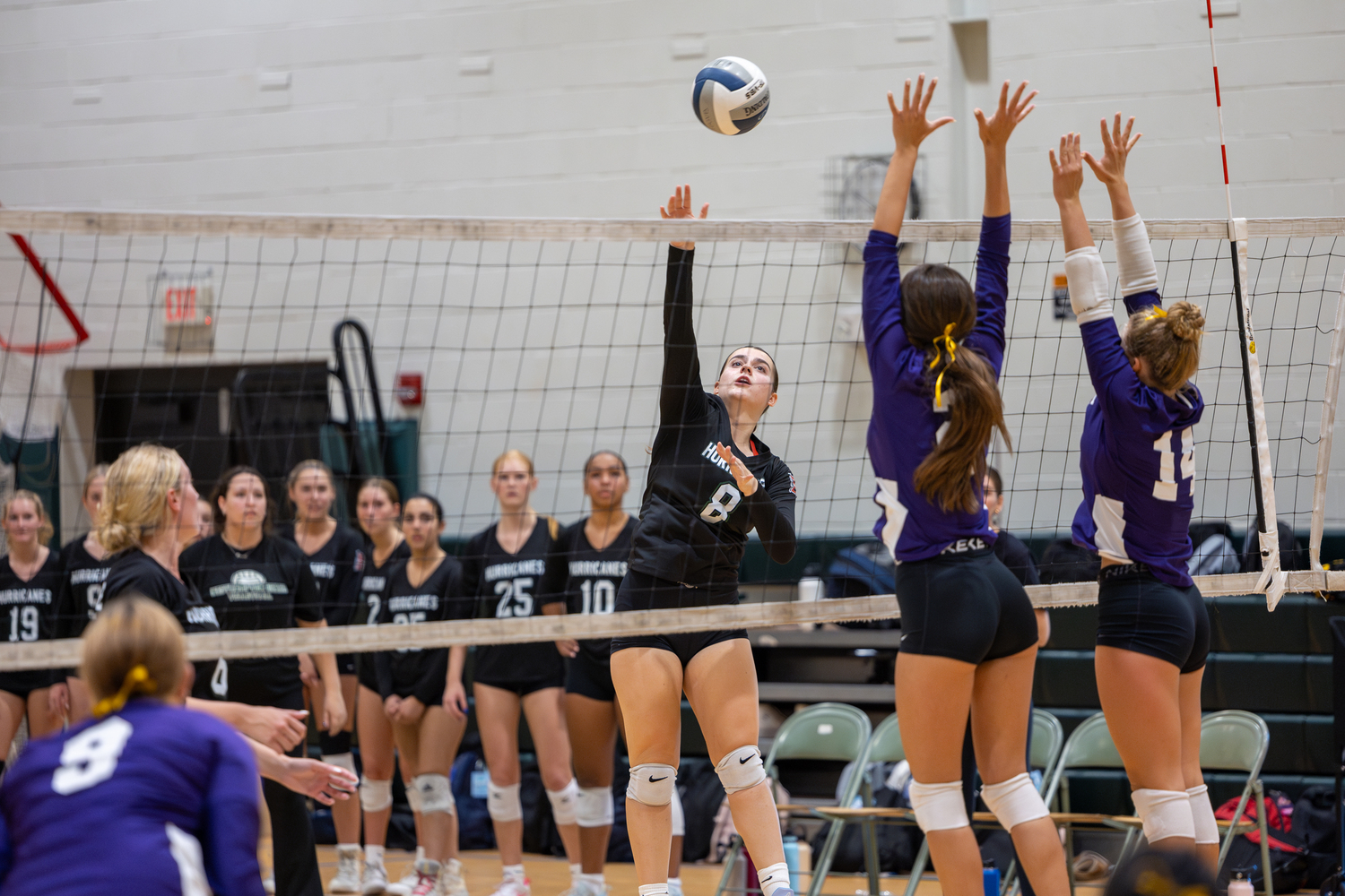 Junior setter Emma O'Camee sets up a play in a game against Islip. RON ESPOSITO