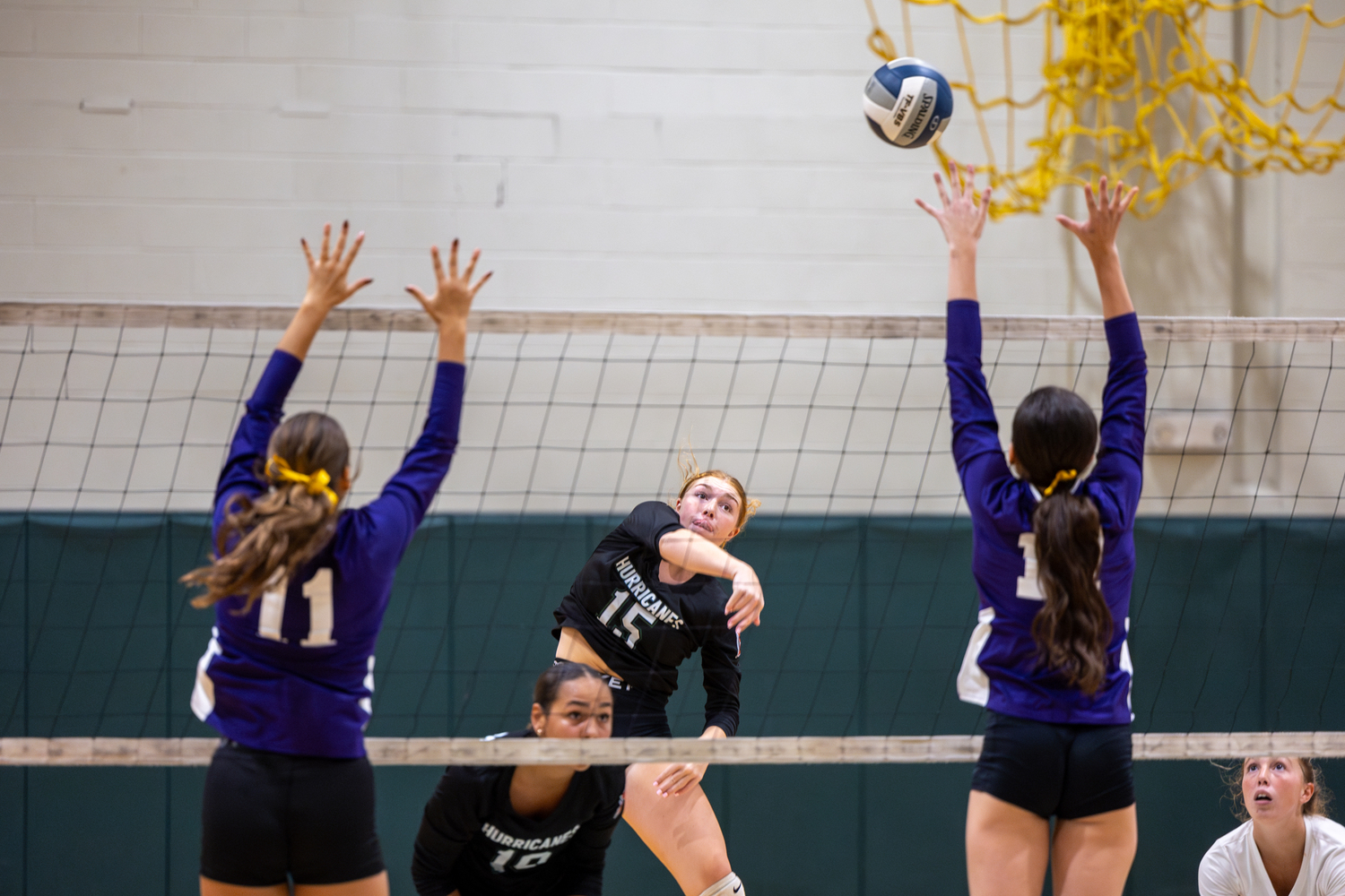 Junior outside hitter Katie Burke sends the ball over the net in a game against Islip. RON ESPOSITO