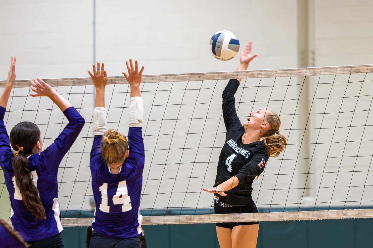 Senior middle Shannon Sweet slams down a kill in a game against Islip. RON ESPOSITO