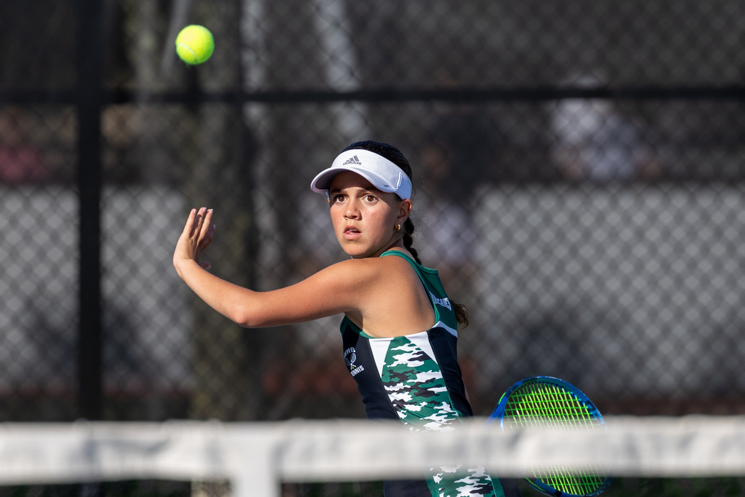 Eight-grader Gabby Arango steadies herself for a return. RON ESPOSITO