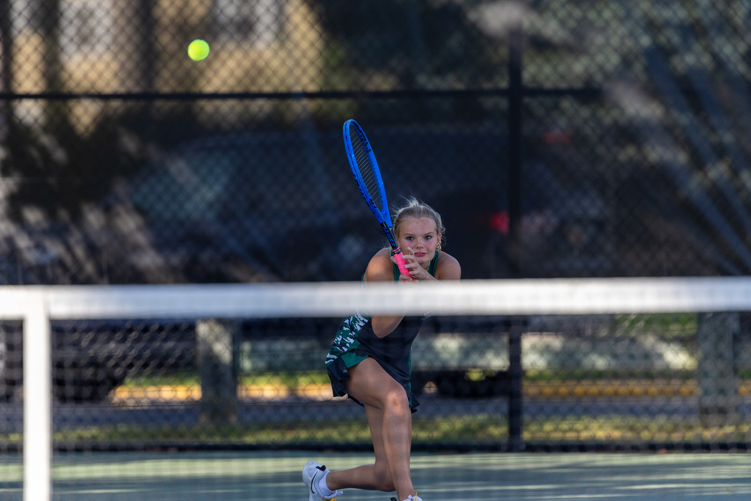 Sophomore Maddie Montgomery pushes the ball back over the net. RON ESPOSITO