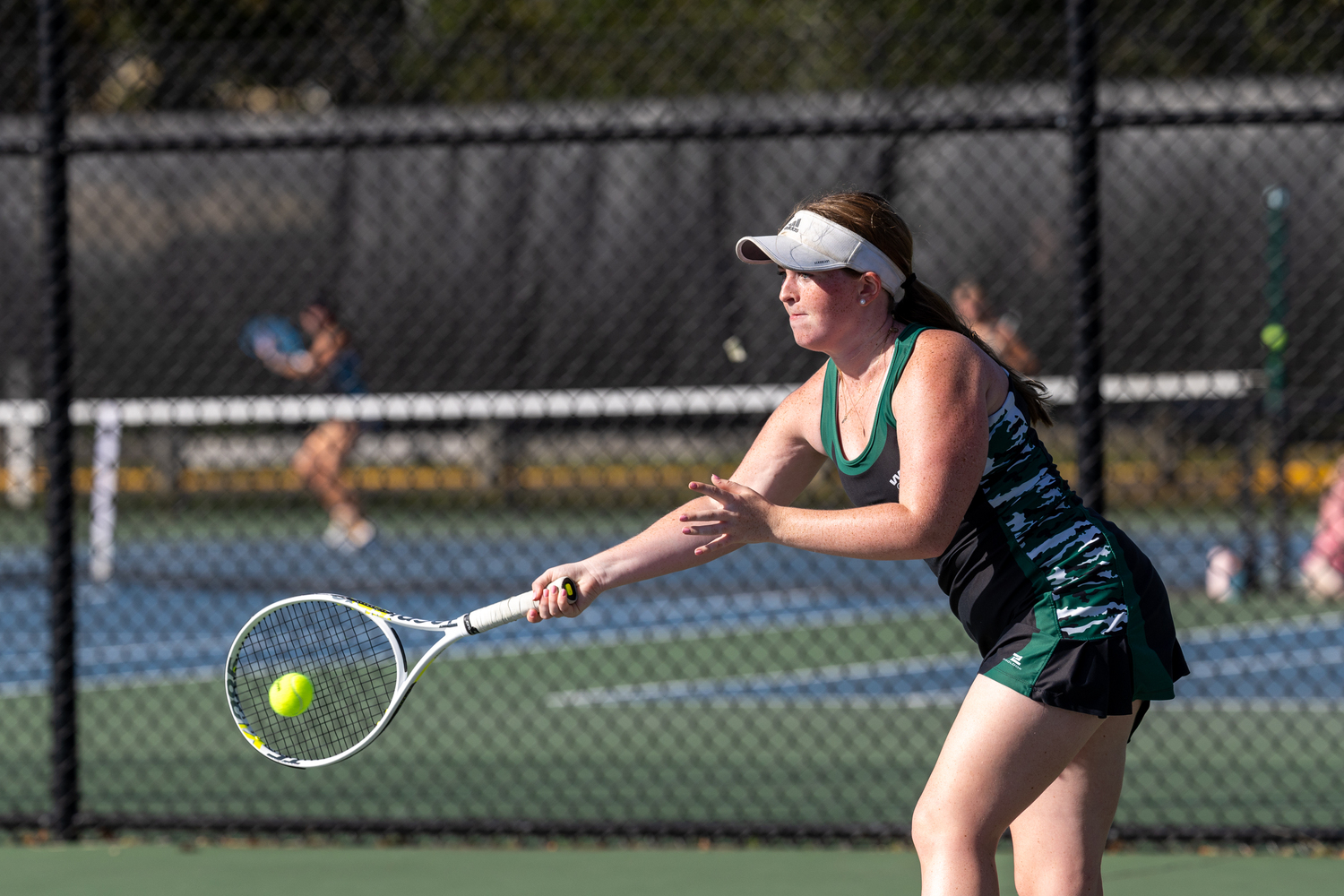 Senior Maggie Gilbride reaches for the ball. RON ESPOSITO