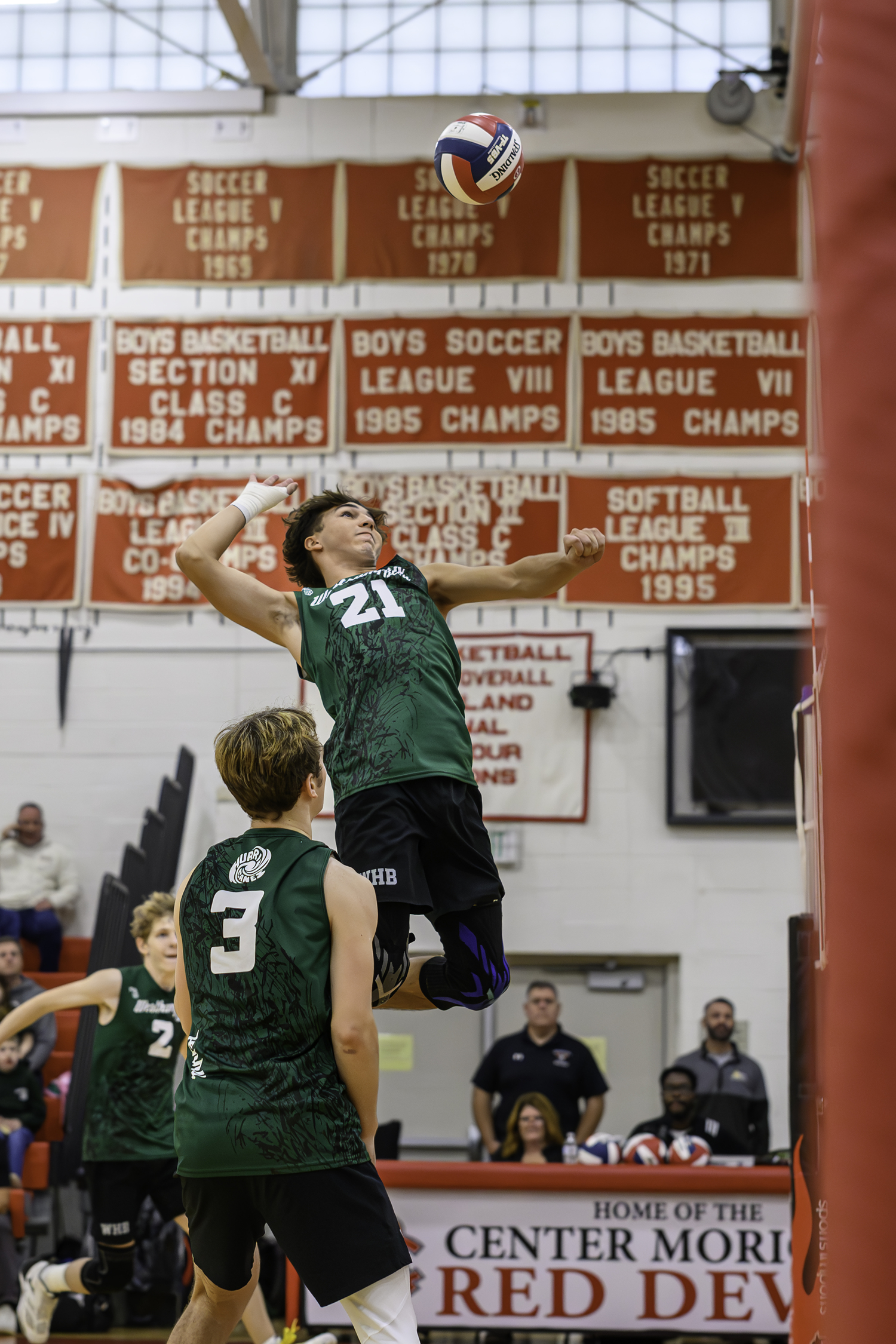 Senior middle blocker James Monserrate spikes the ball during the Hurricanes' Long Island Championship win last season. RON ESPOSITO