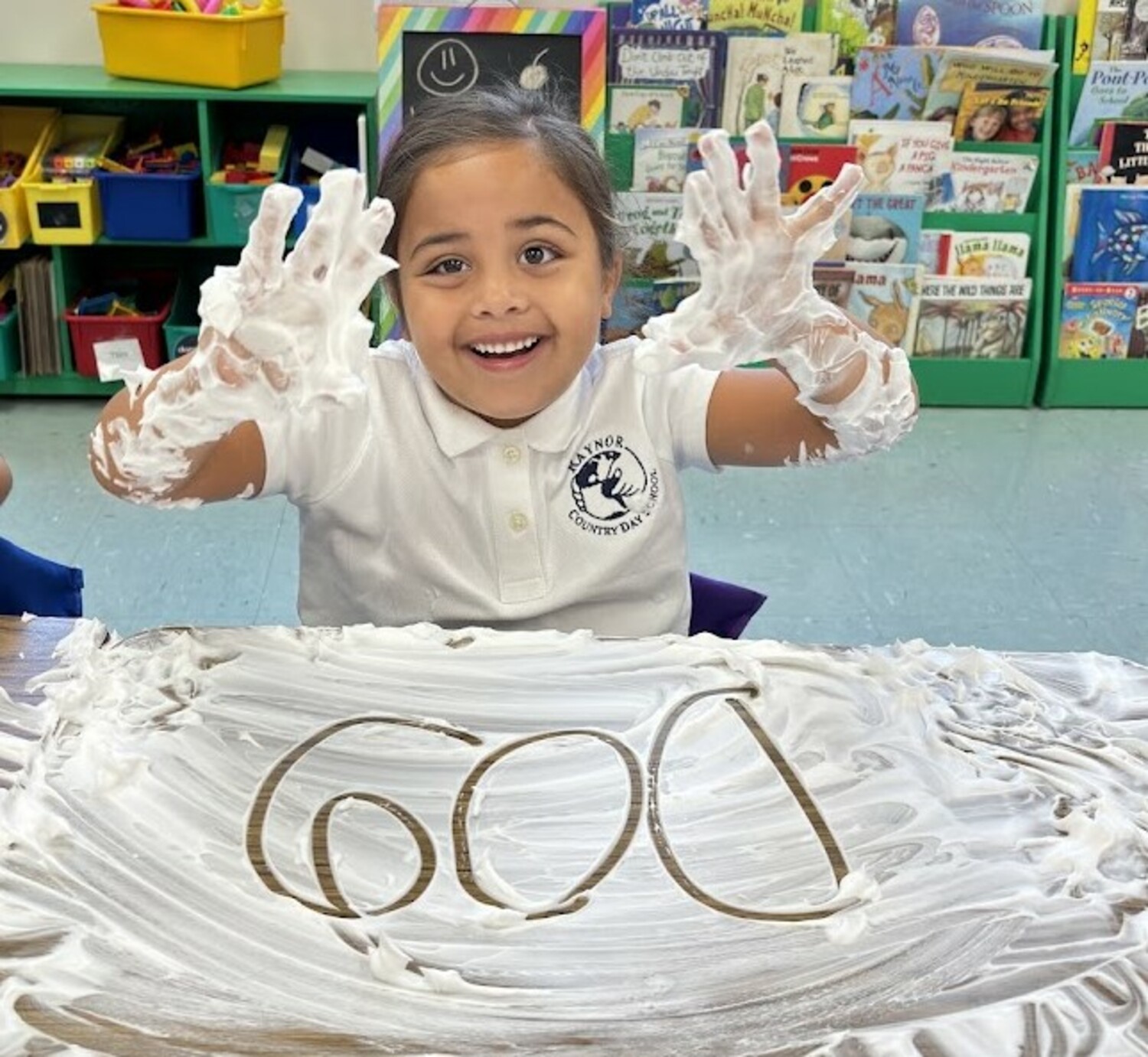 Raynor Country Day School kindergartners Aamani Mandel and Charlotte Burkly loved the fun hands-on writing lesson that involved shaving cream. The sensory material was an exciting canvas to practice properly forming uppercase and lowercase letters, as well as sight words.  COURTESY  RAYNOR COUNTRY DAY SCHOOL