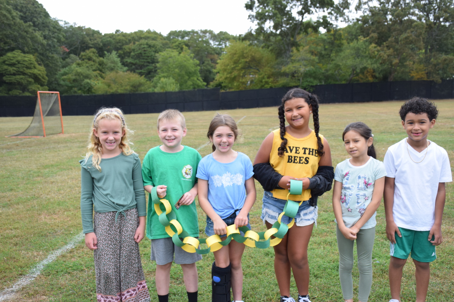 Tuttle Avenue School hosted Start With Hello Week, a social program which encourages students to reach out to peers who may be suffering from social isolation and a lack of connectivity. Wearing green, the students and faculty gathered outside to link kindness chains into a schoolwide chain to symbolize their connection as a community, empathy and inclusivity. Other activities during the week included wearing nametags and purposely saying hello to others. COURTESY EASTPORT-SOUTH MANOR SCHOOL DISTRICT