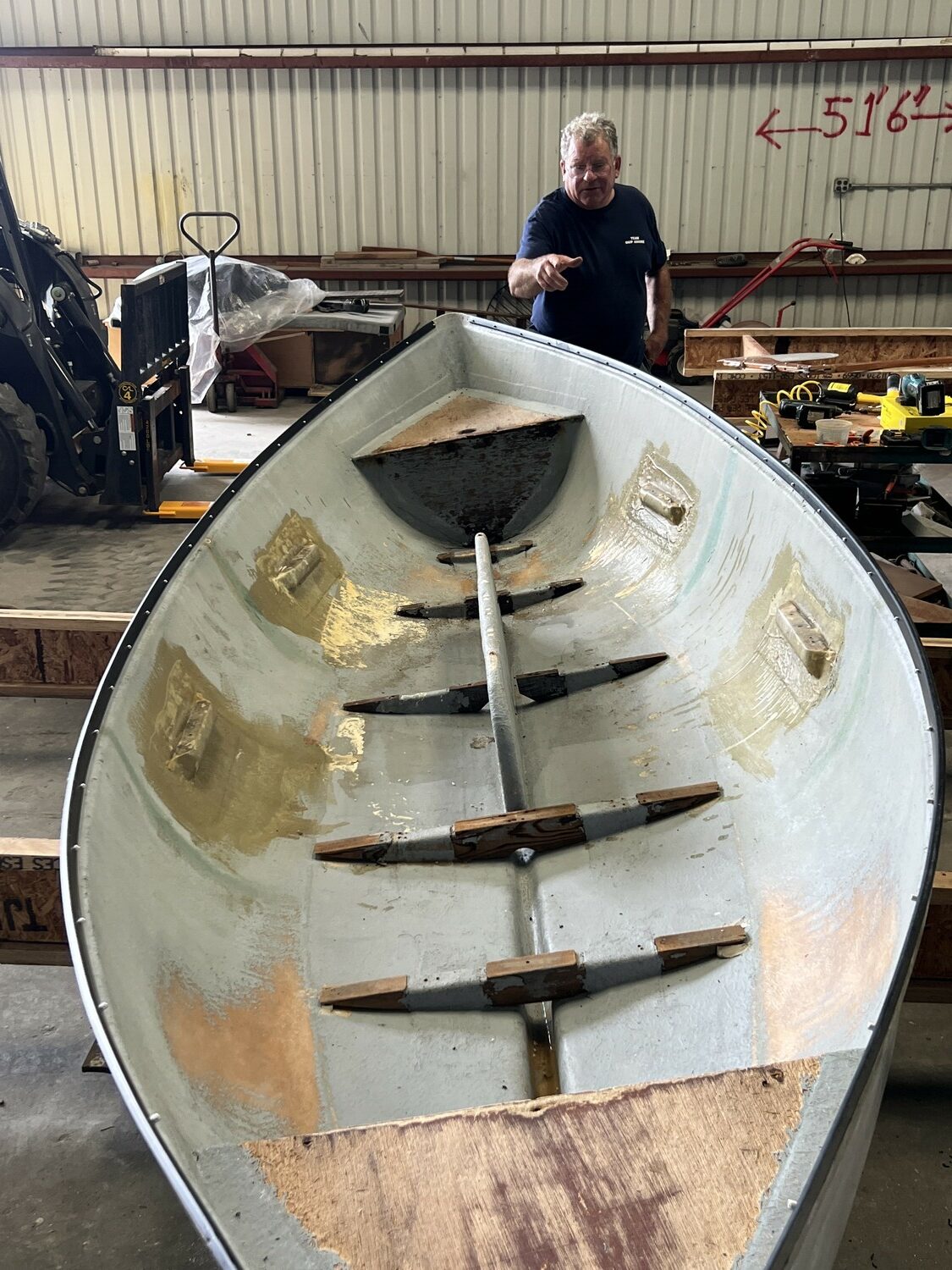 Rick Pickering, the owner of Ship Ashore Marina, working on the HarborFest whaleboats earlier this year. Gavin Menu photo